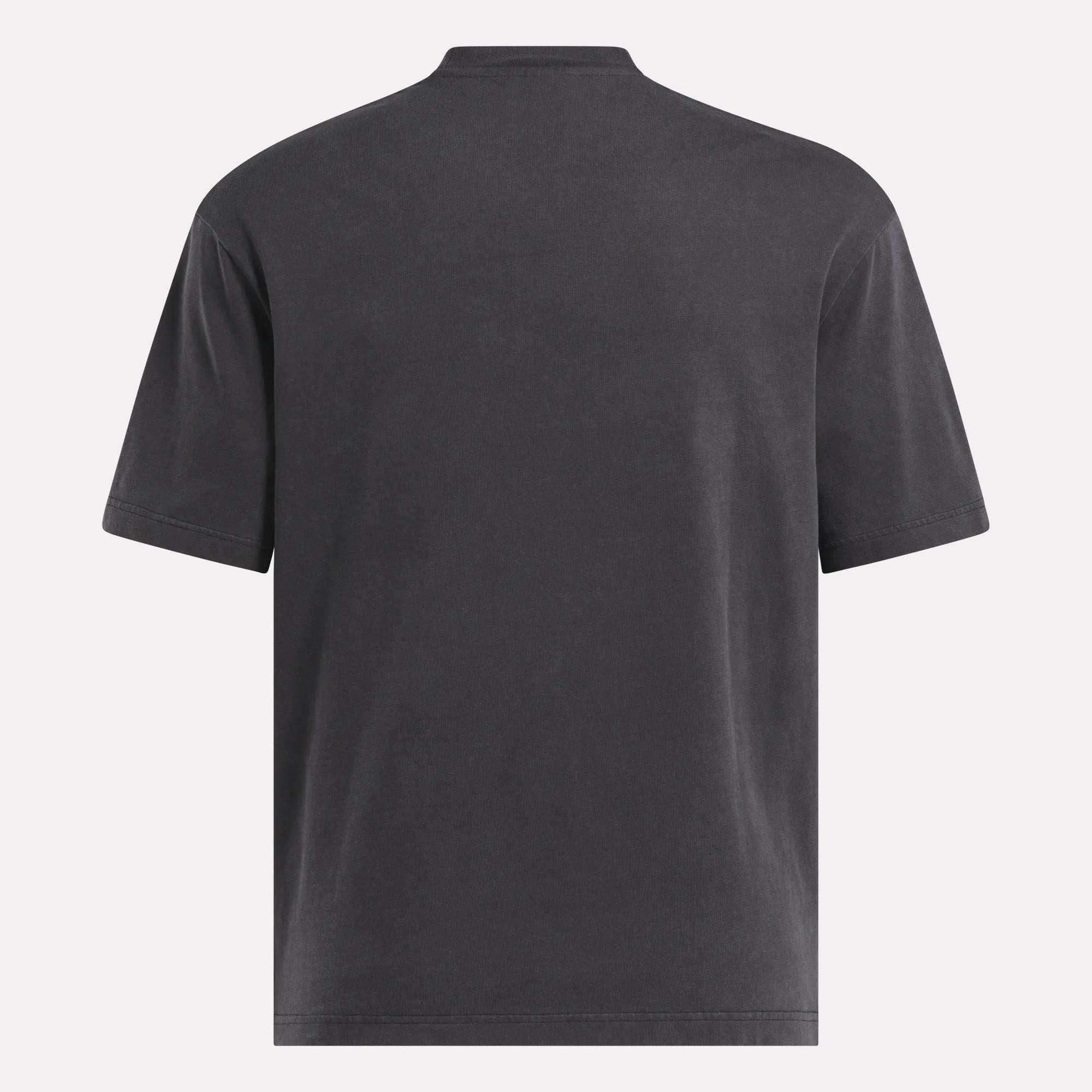 The Reebok x MARKET Graphic T-Shirt, shown from the back in dark gray with short sleeves, stands out against a light background—perfect for a minimalist streetwear vibe.