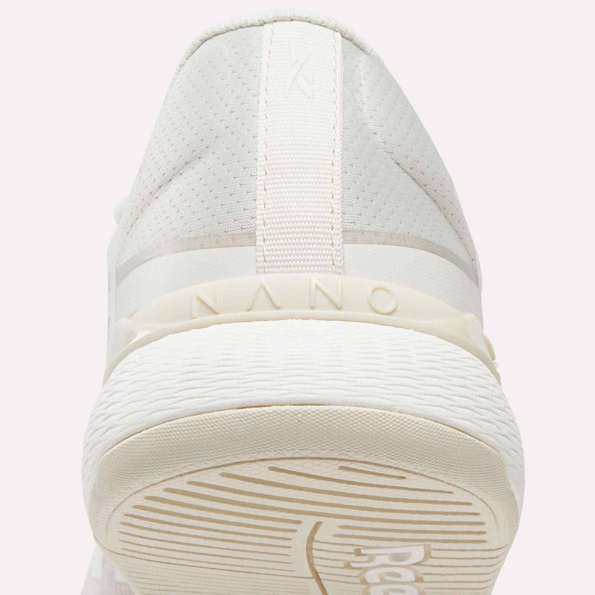 Close-up rear view of the Reebok Women's Nano X5 Training Shoes, featuring 'NANO' embossed above the textured rubber sole and subtle stitching details on the heel—perfect for women's training shoe collections.