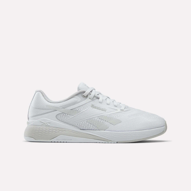 A side view of the Reebok Nano X5 Training Shoes in white, featuring mesh material, white laces, and a textured sole, offering comfort for running—displayed against a plain white background.