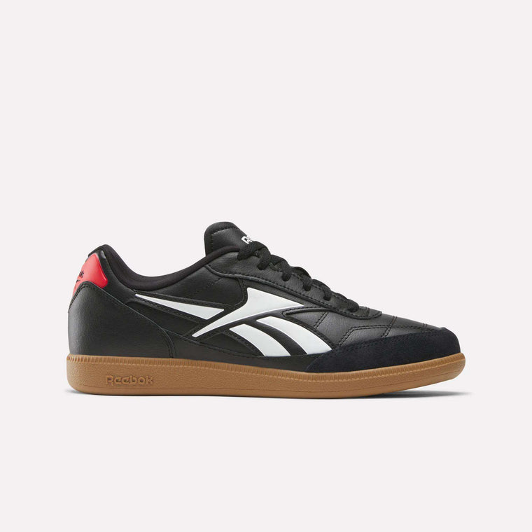 The Reebok Finale Shoes feature a black upper, white side stripes, brown rubber sole, and red heel accent, shown in a side view against a plain white background for classic retro sport style.