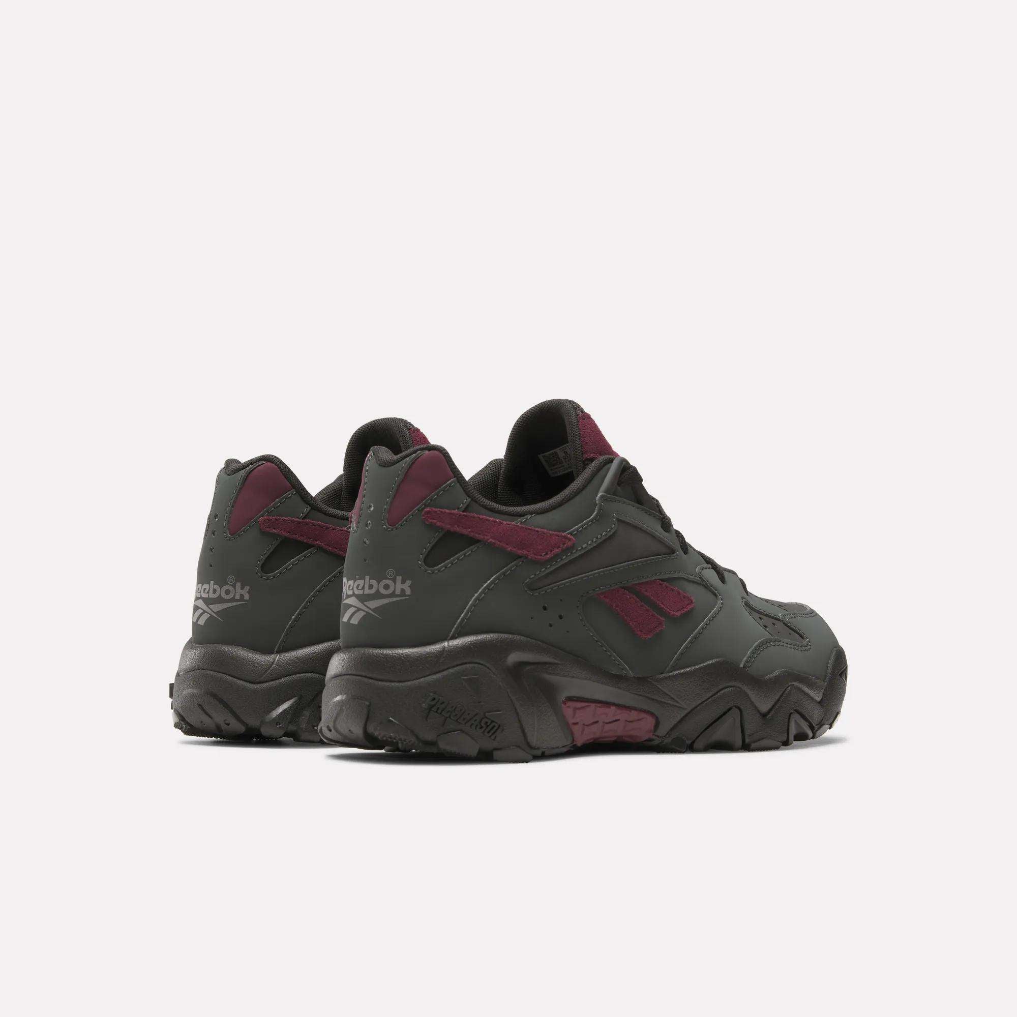 A pair of Preseason 94 Low Retro Basketball Shoes by Reebok in dark gray with maroon accents and the classic logo, shown on a plain white background.