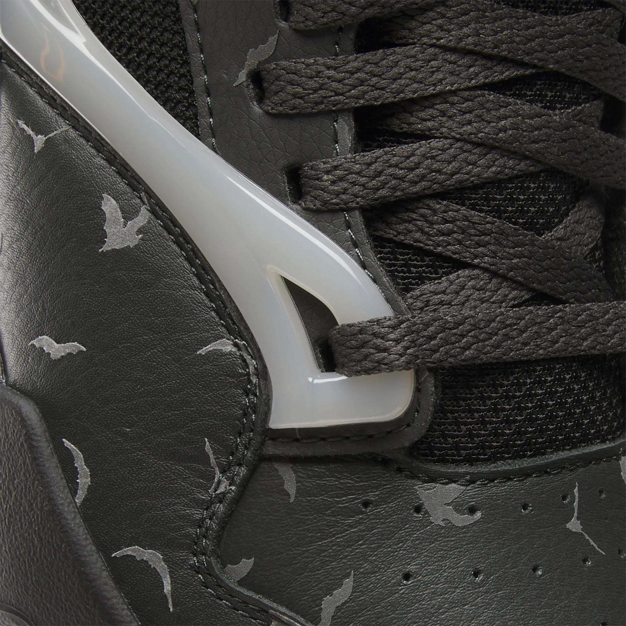 Close-up of the Reebok Pump Omni Zone II Retro Basketball Shoes featuring dark leather, black textured laces, glossy white plastic accents, reflective details, and a light gray bat pattern printed on the leather.