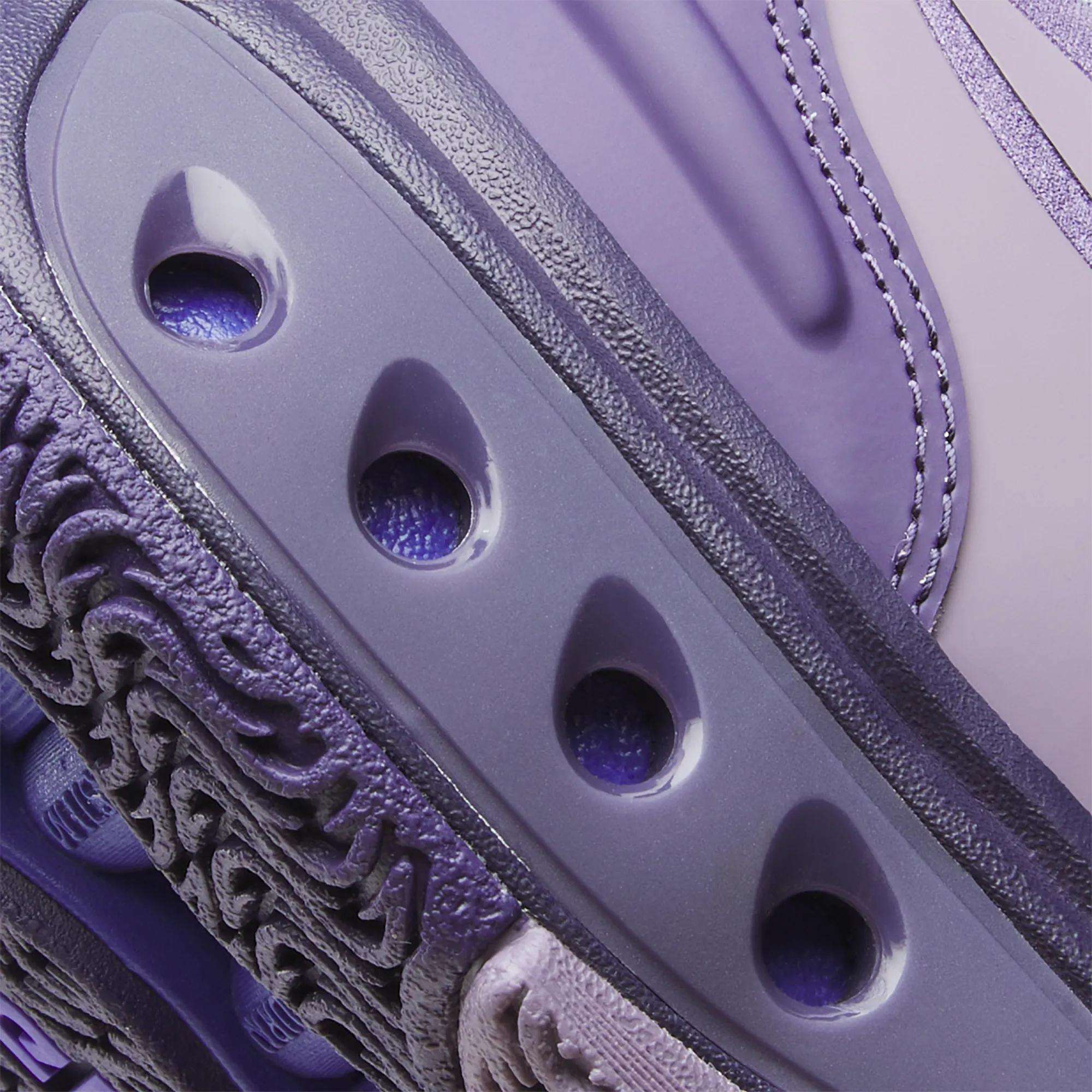 Close-up of Reebok Engine A Basketball Shoes in purple/lavender, showcasing textured and smooth surfaces, detailed stitching, three oval ventilation holes, and advanced SuperFloat foam for superior comfort.