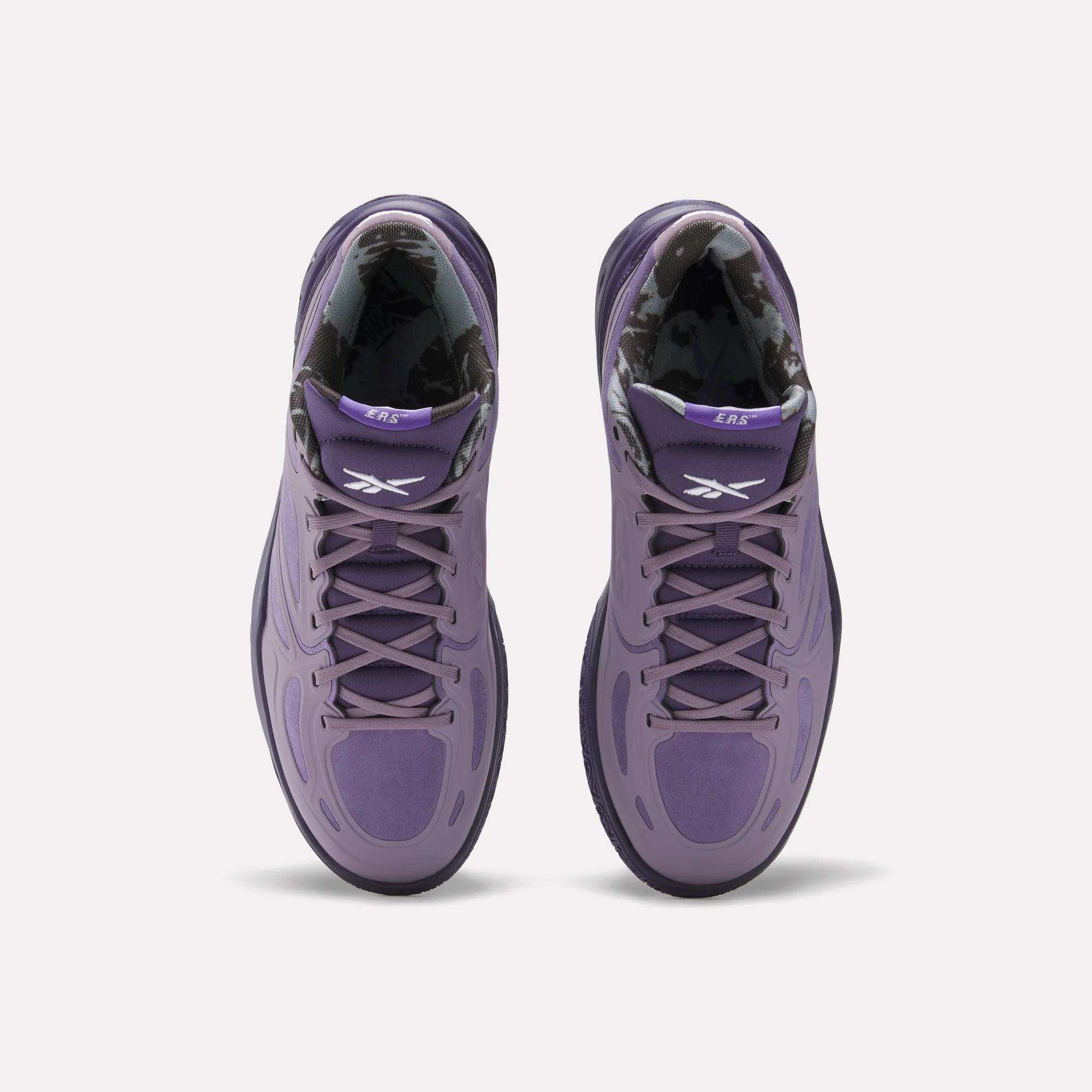 Top view of Reebok Engine A Basketball Shoes in purple with black and white patterned inner lining, white Reebok logos on the tongues, and advanced ERS technology, set against a plain white background.