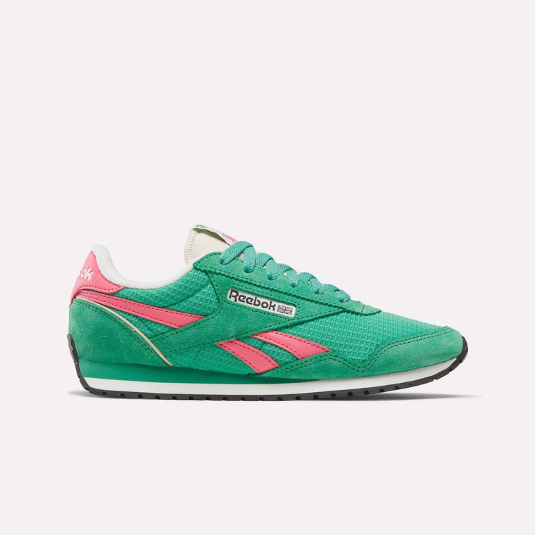 The Reebok Women's Classic AZ Shoes are shown in a side profile view. This green shoe features pink accents, white lining, a black sole, and retro running style with visible Reebok logos on the side and heel against a white background.