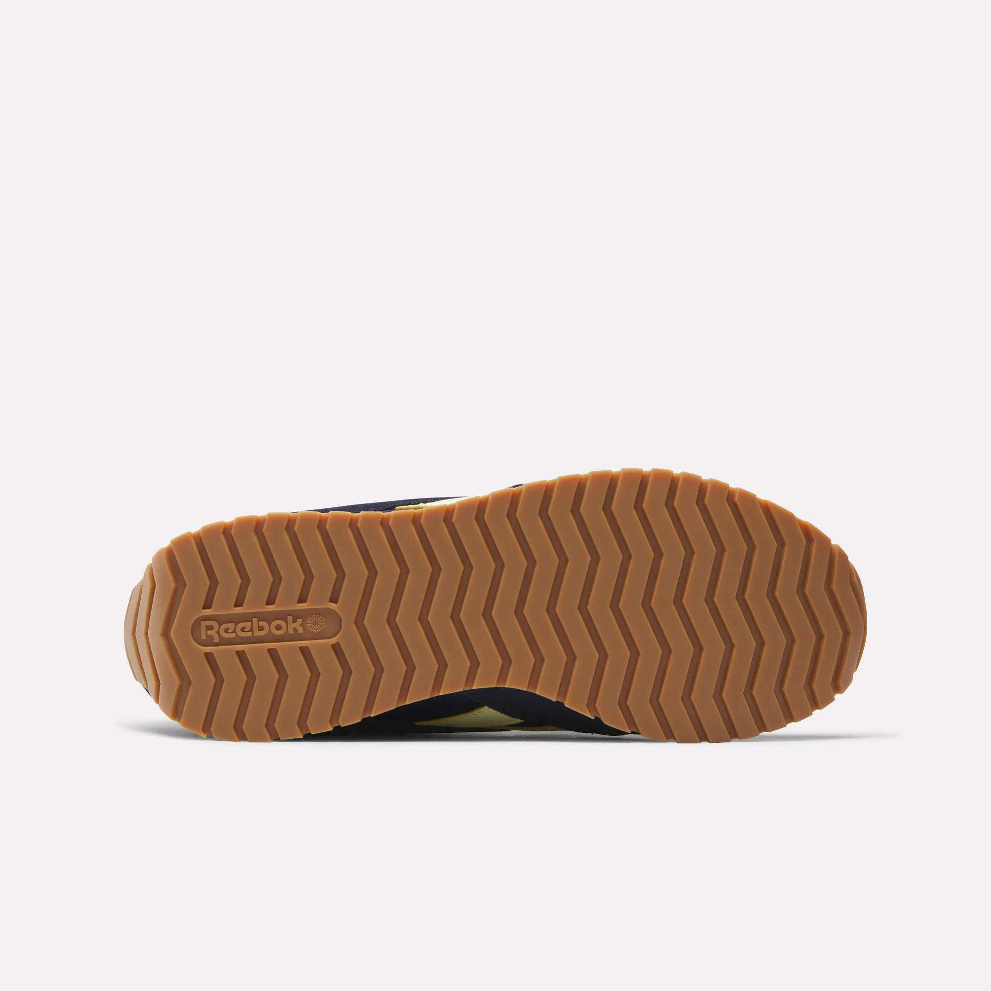 A close-up of the Women's Classic AZ Shoes by Reebok, showcasing their timeless design and retro-inspired details.