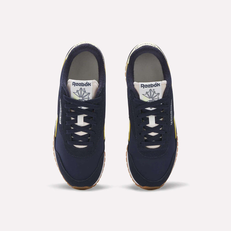 A pair of Women's Classic AZ Shoes by Reebok in navy blue, shown from above with white laces, branded tongue labels, and gum soles—ideal for adding vintage flair to your women's sneaker collection.