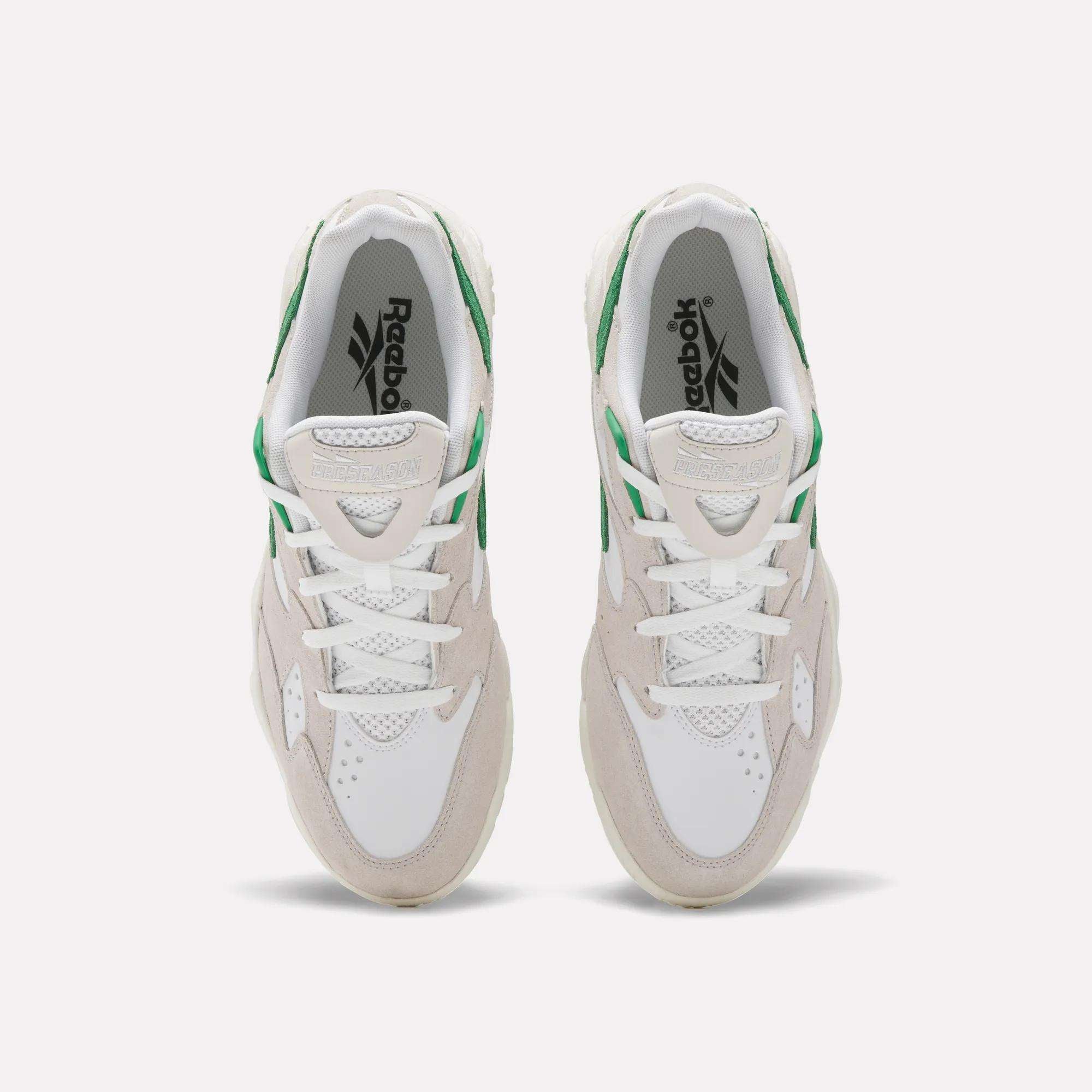 A top view of Reebok Preseason 94 Low Retro Basketball Shoes in white with beige suede and green accents, inspired by '90s athletic styles, displayed on a plain light background.