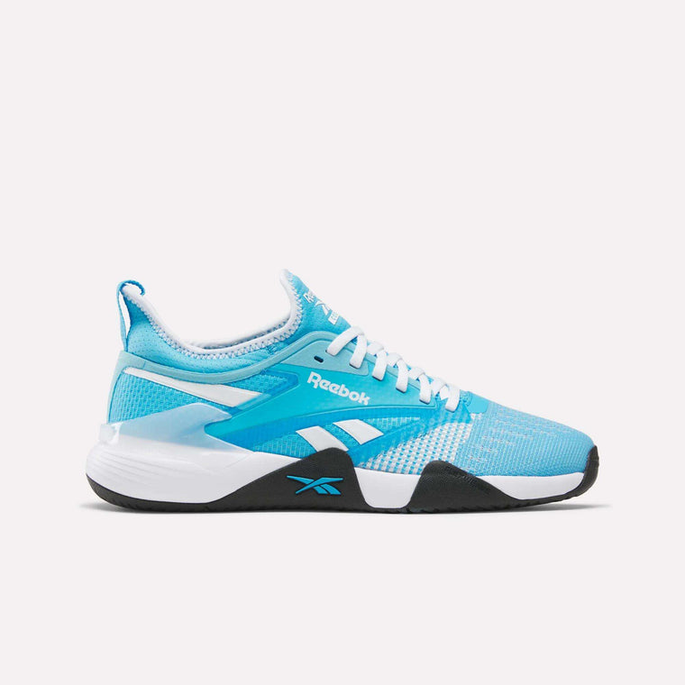 The Reebok Nano Court Shoes are light blue training shoes with white laces, white and black details, a black outsole for multidirectional traction, and the Reebok logo—ideal for court sports and displayed on a plain white background.