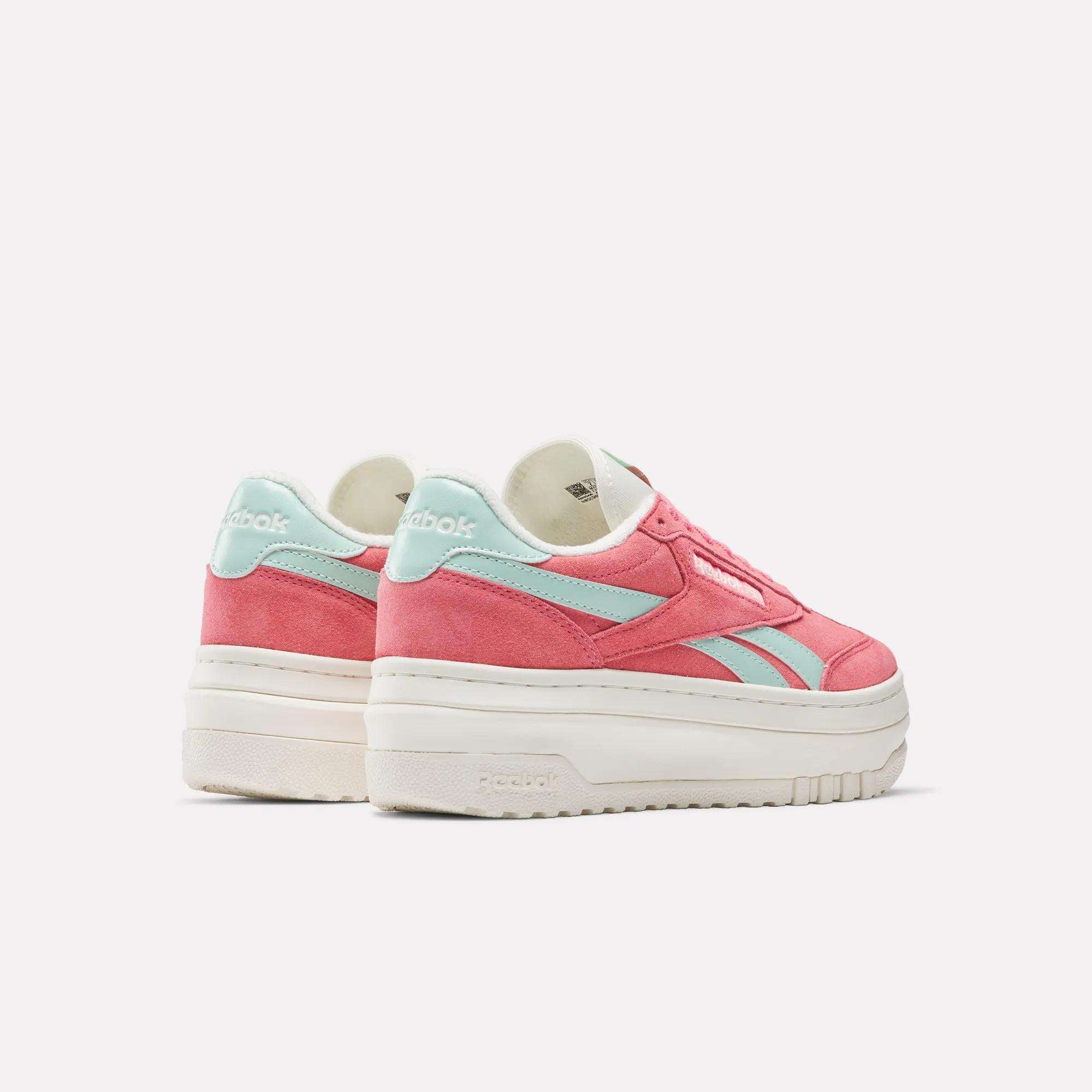 The Reebok Campio Extra Women's Shoes feature thick white platform midsoles, pink suede uppers, and light blue accents and logos, shown against a plain light background.
