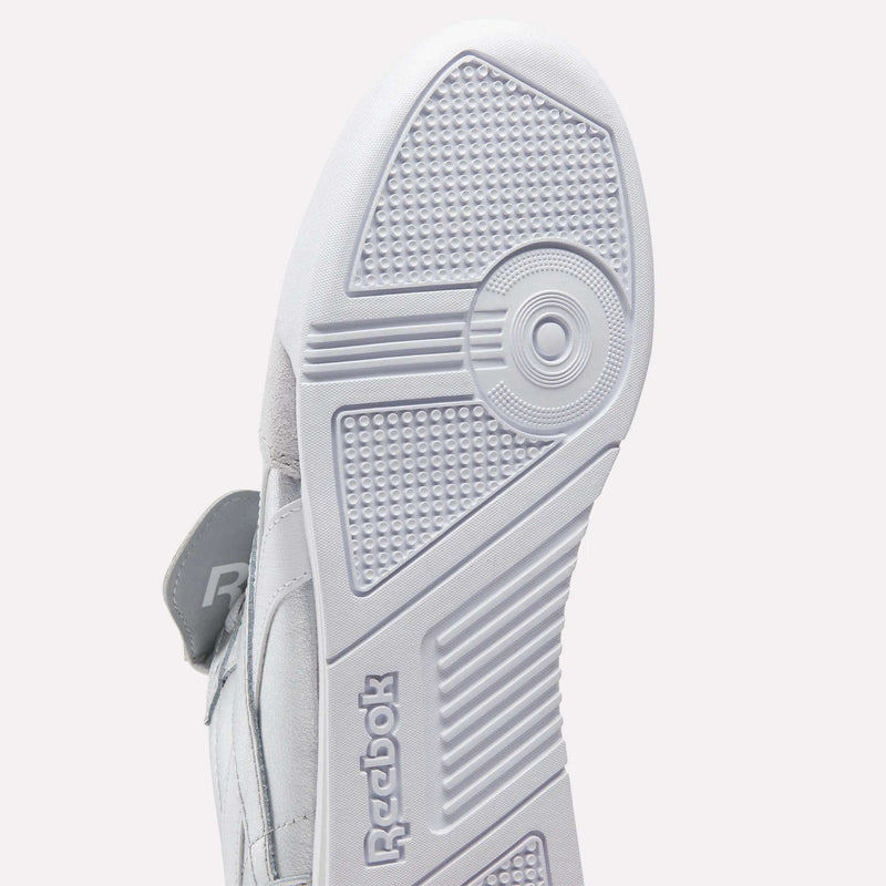 Close-up of the white sole on Reebok Campio XT Kilty Shoes, highlighting the detailed tread and embossed Reebok logo near the heel—a tennis-inspired feature of classic Reebok design.