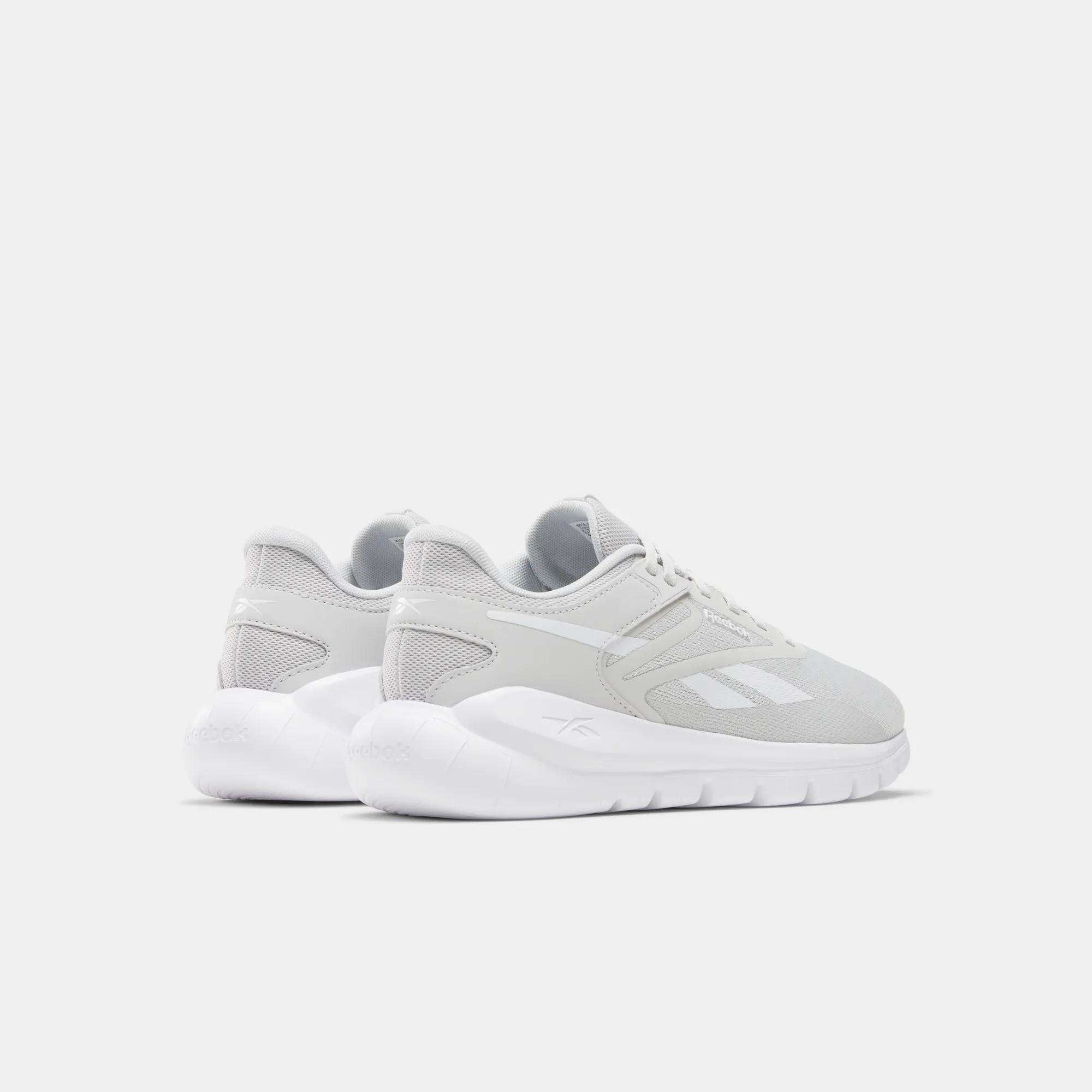 Men's Split Flex Training Shoes by Reebok, in light gray with white soles, are shown from the back and side on a white background. Their mesh and synthetic build is perfect for HIIT classes, with the Reebok logo clearly visible.