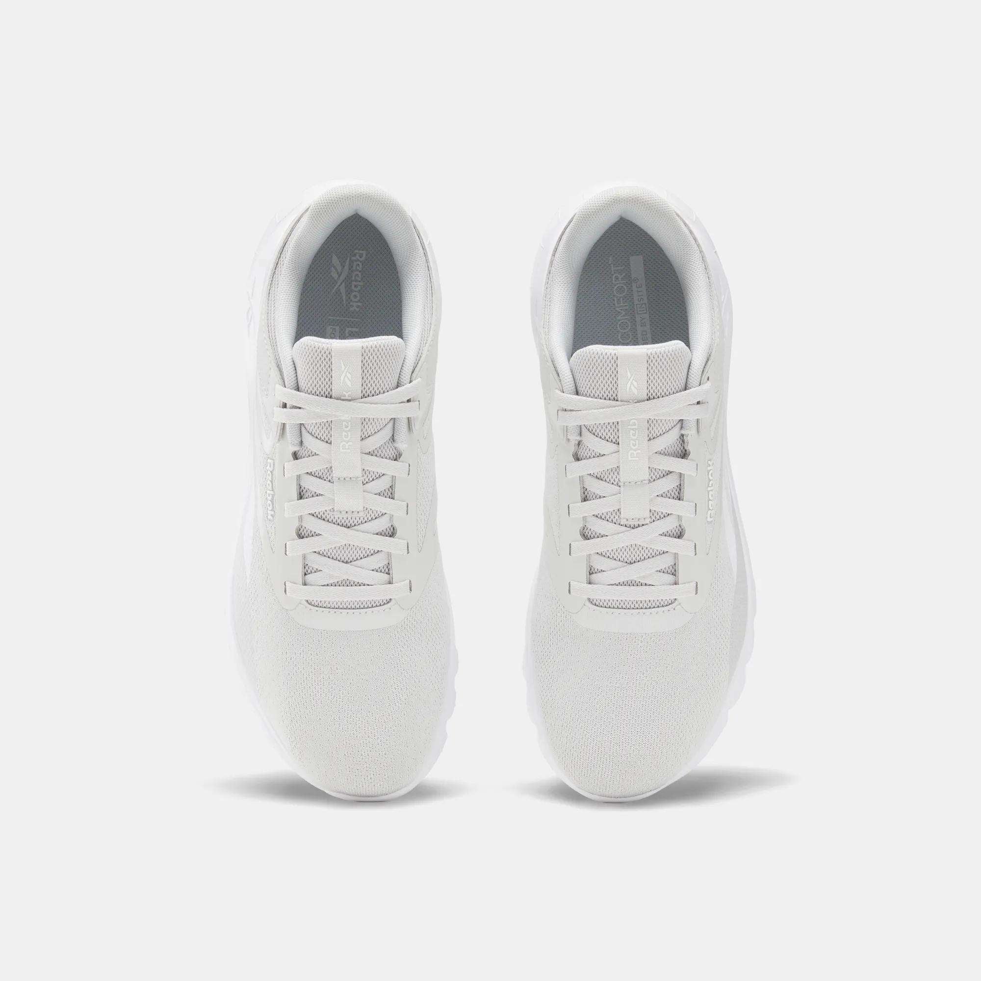 Top view of Reebok Men's Split Flex Training Shoes in white with mesh uppers and white laces, placed side by side on a light gray background—ideal for HIIT sessions or everyday workouts.