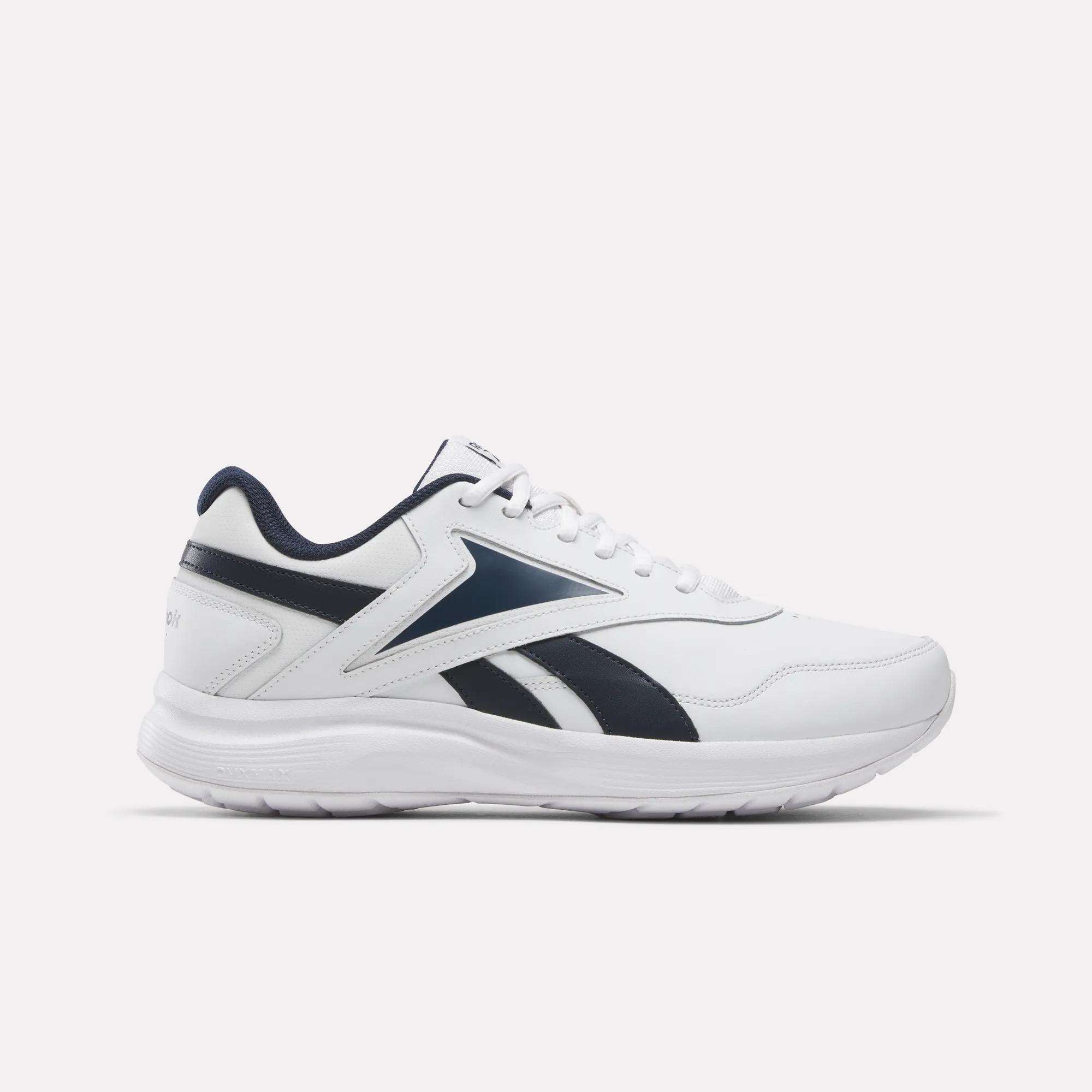 White athletic shoe with black accents on a light gray background