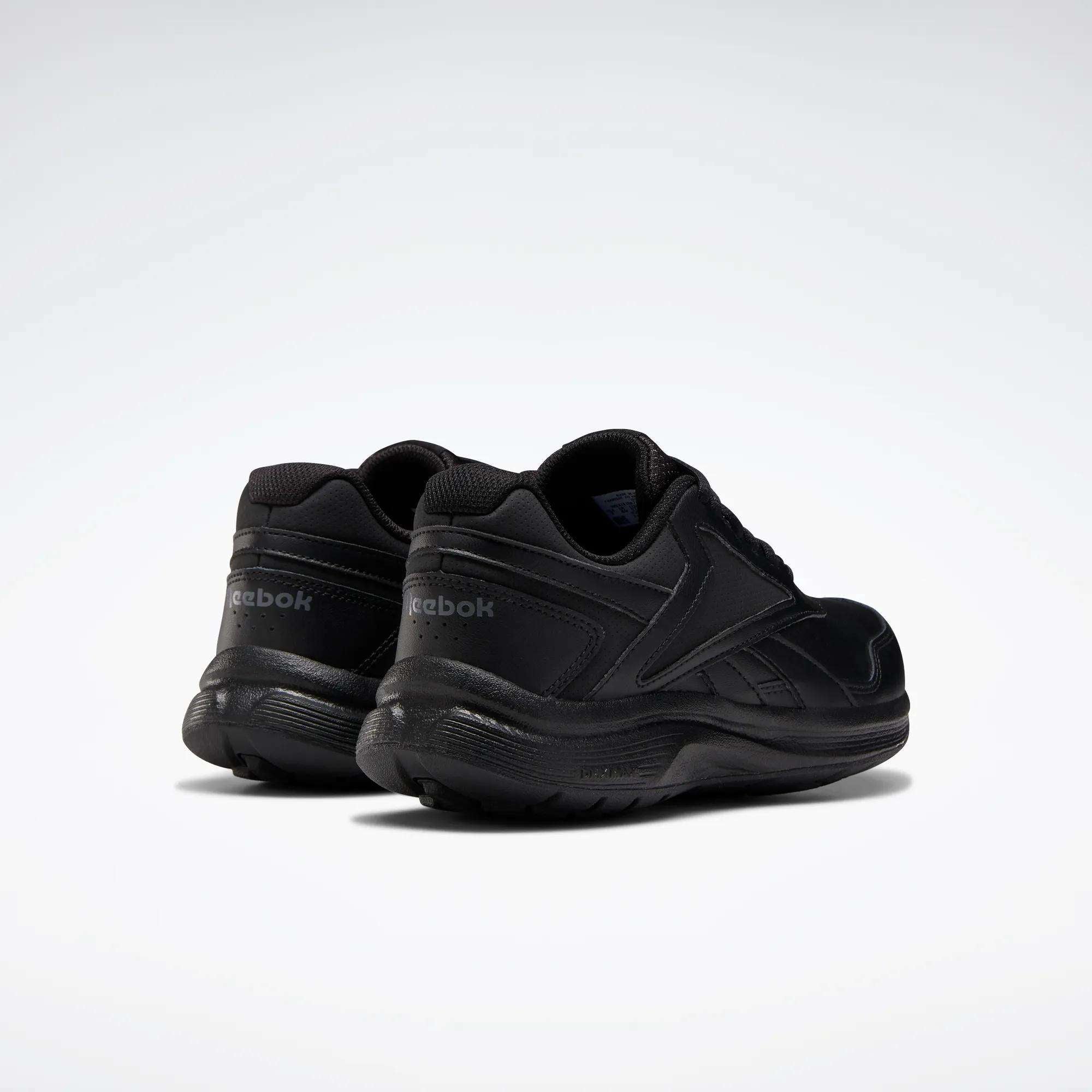 The image shows Reebok Women's Walk Ultra 7 DMX Max Walking Shoes in black on a white background, angled to display the back and sides, emphasizing their DMX cushioning for superior comfort.