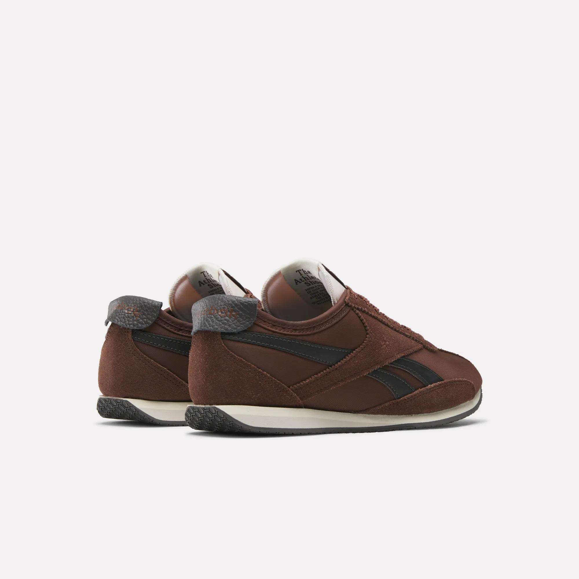 A pair of brown and black Reebok R400 Shoes with retro suede and leather accents, displayed from a rear side angle on a light background.