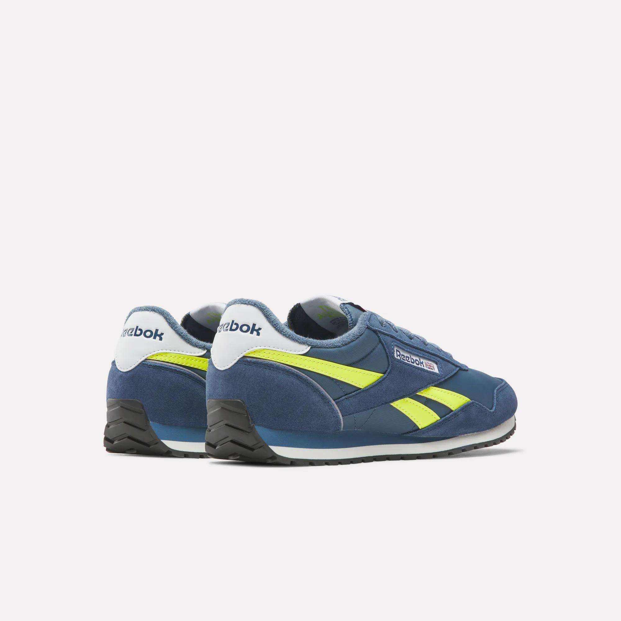 Reebok Classic AZ Shoes in blue feature neon yellow stripes and white midsoles, displayed from a rear side angle on a plain white background—ideal for those who love retro running shoes and timeless '70s style.