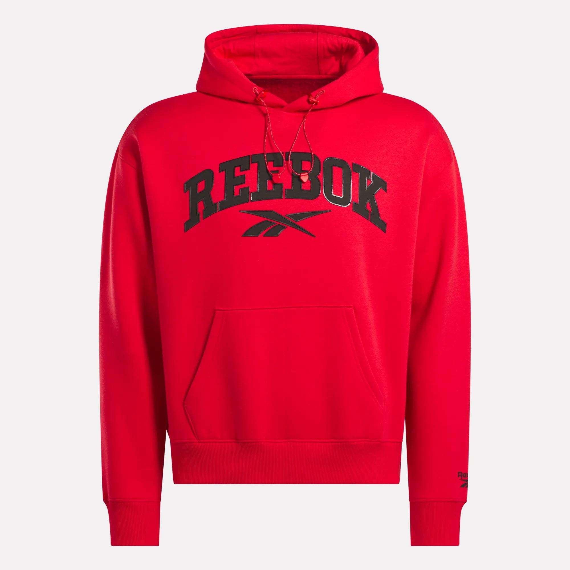 The Men's Hoodie by Reebok is bright red with black REEBOK text and logo on the chest. It features soft material, a front pocket, and hood drawstrings, shown against a plain white background.