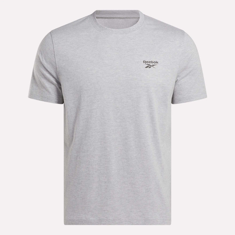 The Reebok Men's Small Logo Crewneck Short Sleeve T-Shirt features a classic fit in light grey, made from soft cotton jersey with short sleeves, a crew neckline, and a small black Reebok logo on the left chest.