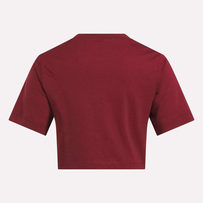A Reebok Women's Two-Color Logo Crew Cropped Short Sleeve Tee is shown from the back against a white background.