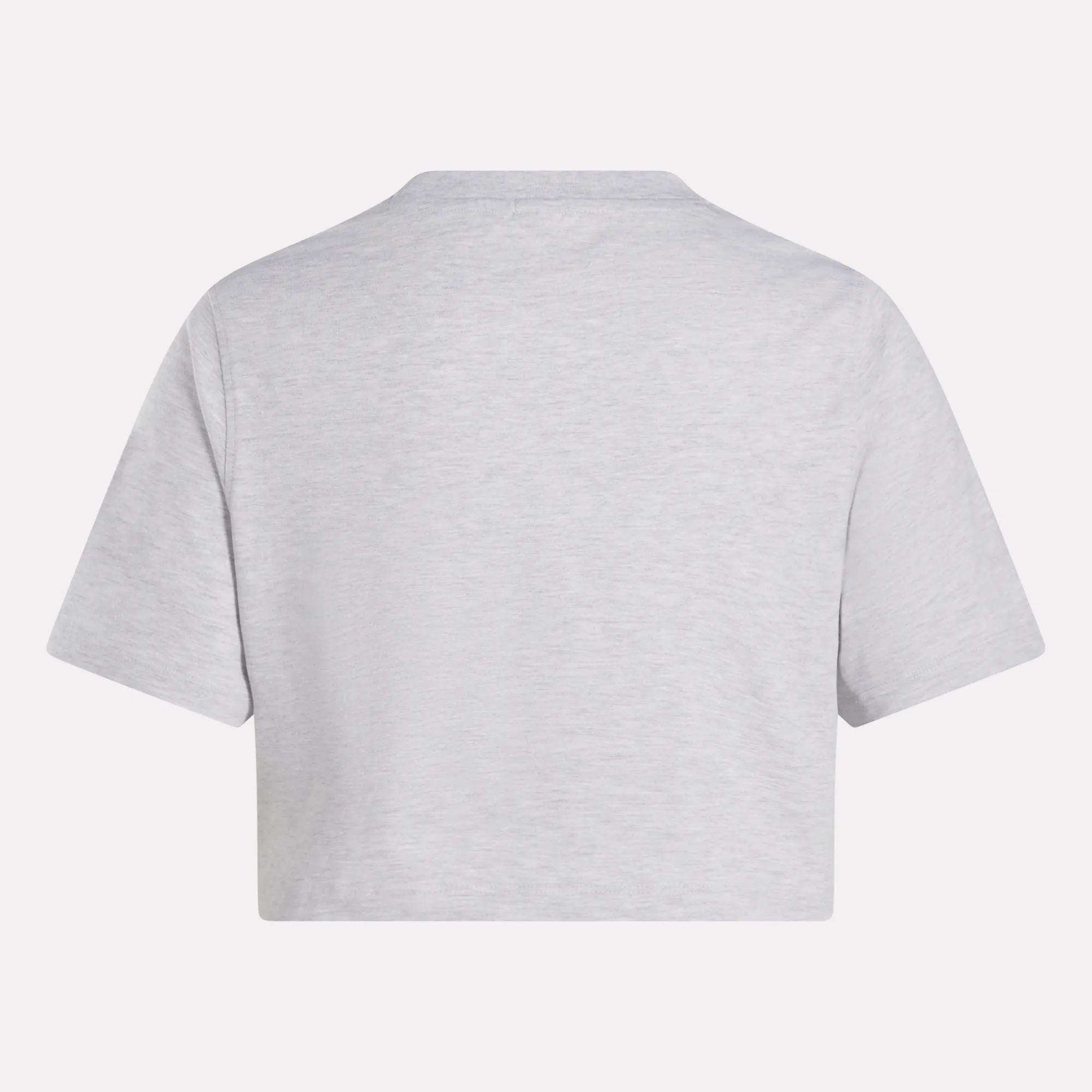 The Reebok Women's Two-Color Logo Crew Cropped Short Sleeve Tee is shown from the back in plain light gray against a white background.