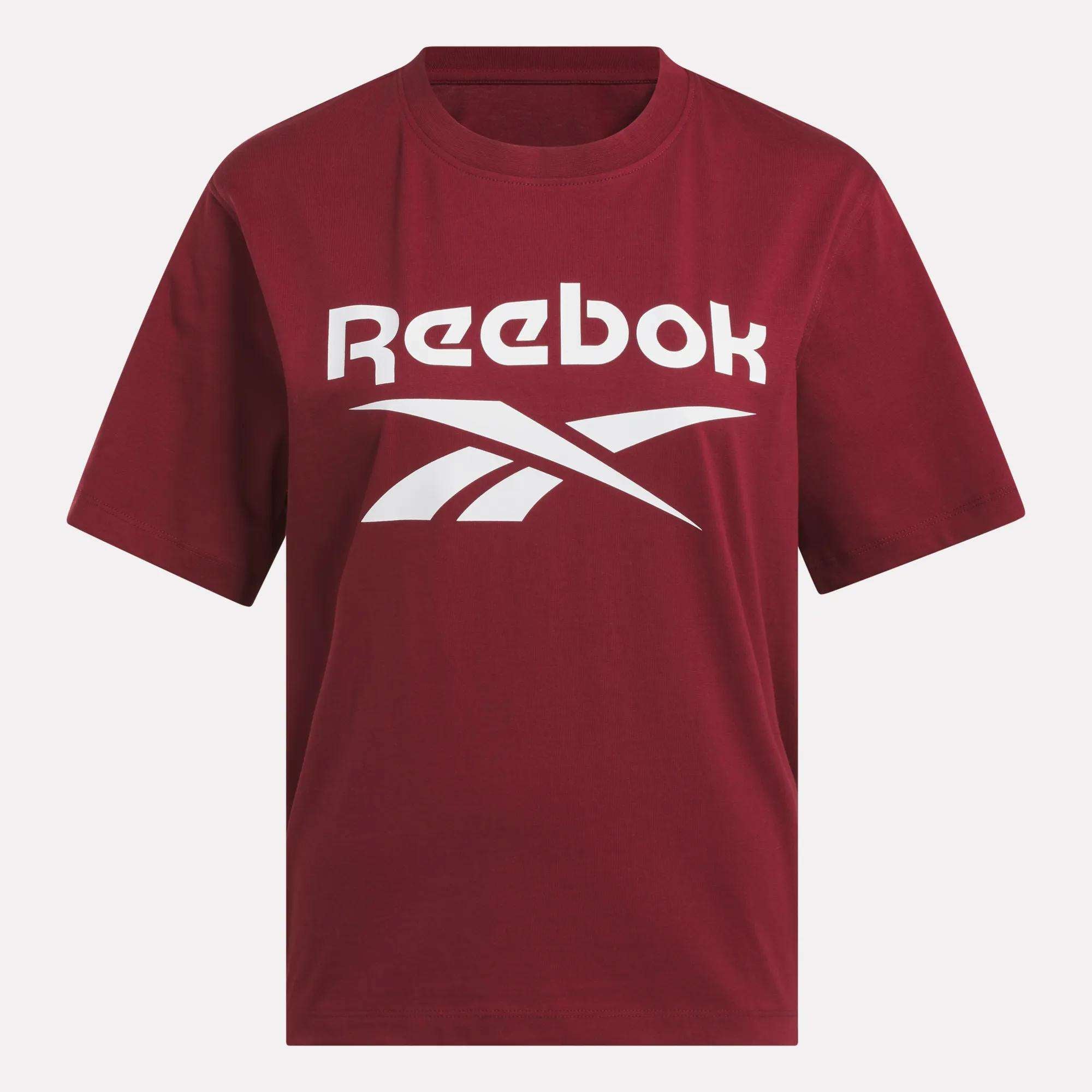 The Women's Big Logo Oversized Crew Short Sleeve Tee by Reebok features a maroon color, white Reebok logo and name across the chest, short sleeves, a classic neckline, and an oversized fit for comfort.