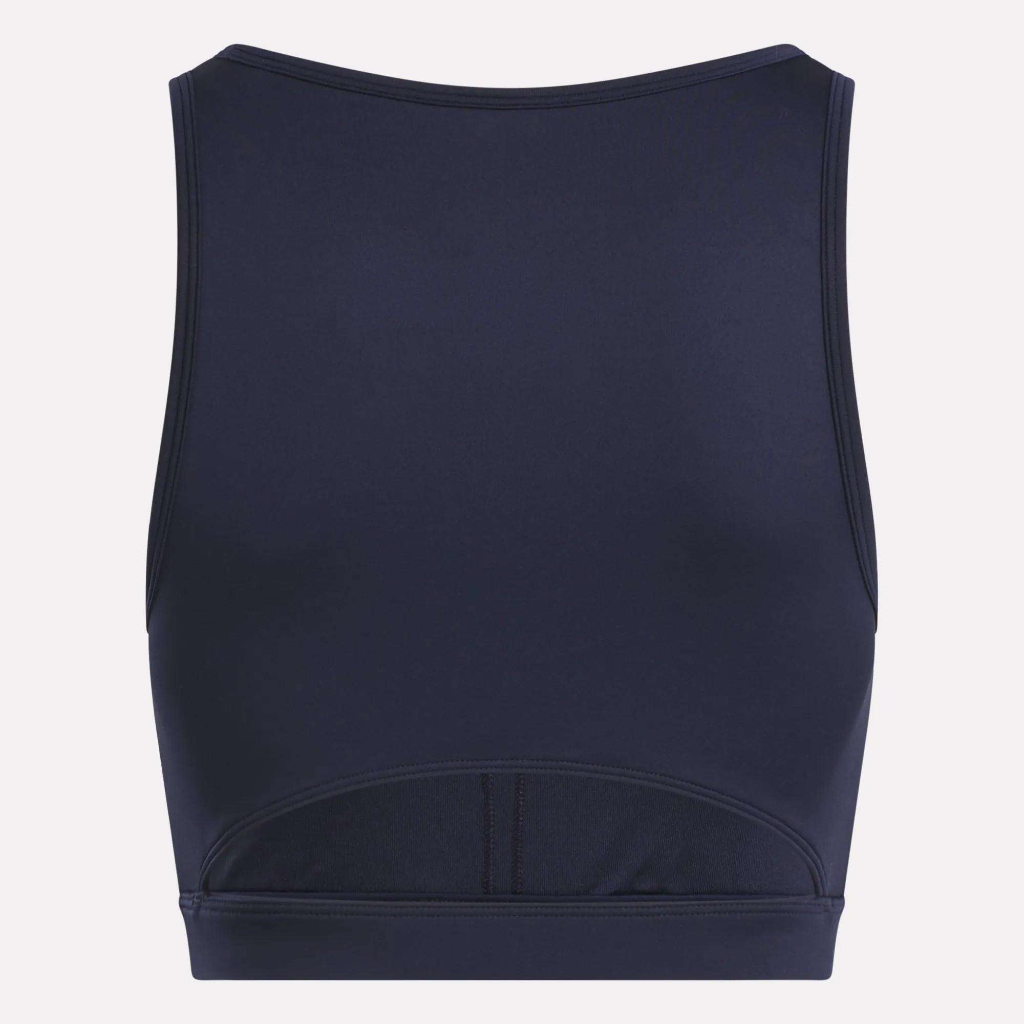 The Reebok Women's Core High-Impact Bra is shown from the back in navy blue, featuring a high neckline, sleeveless design, sweat-wicking fitted fabric, and subtle seam details—ideal for high-impact workouts.