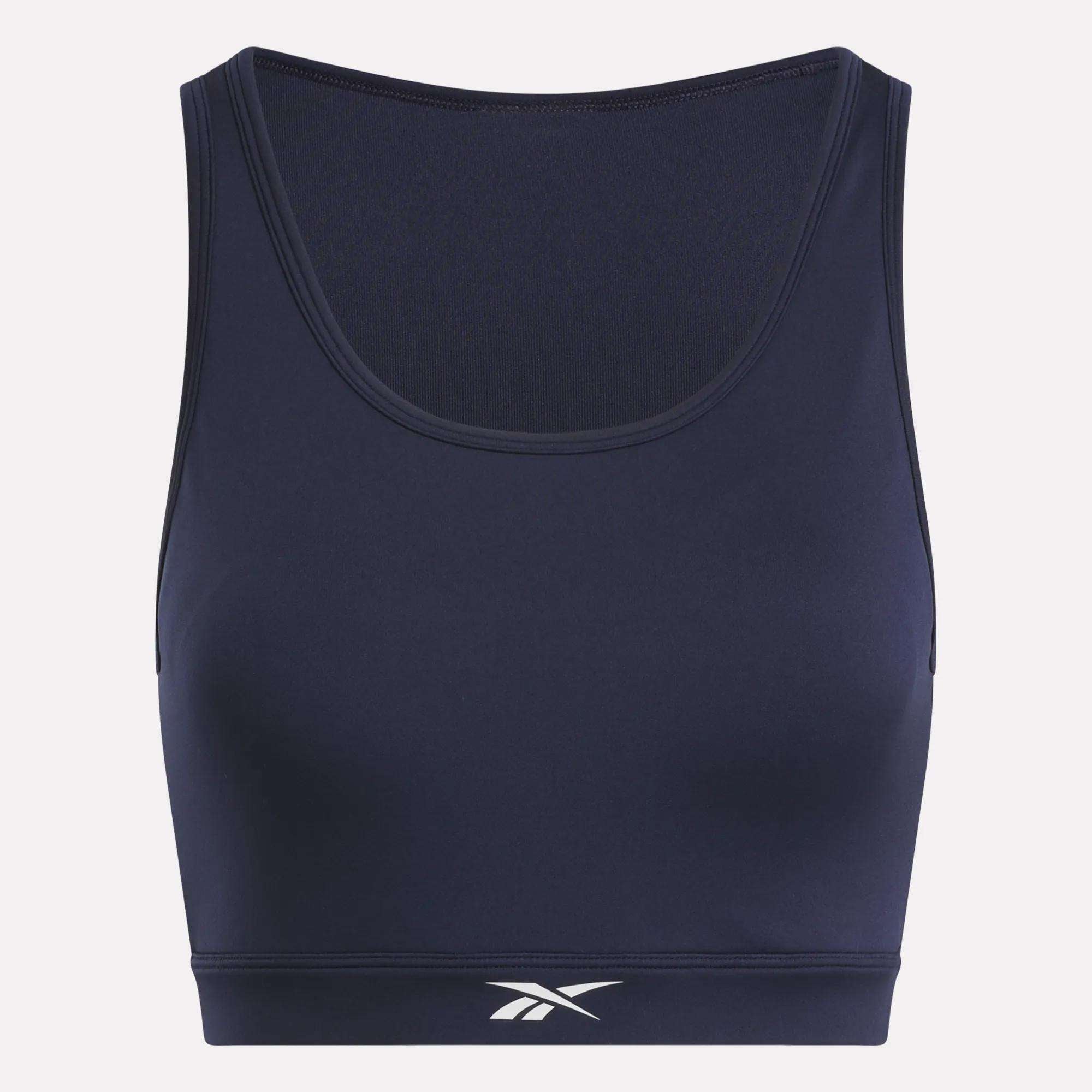 The Reebok Women's Core High-Impact Bra features sweat-wicking fabric, a navy hue, scoop neckline, and white Reebok logo below the bust—ideal support for high-intensity workouts.