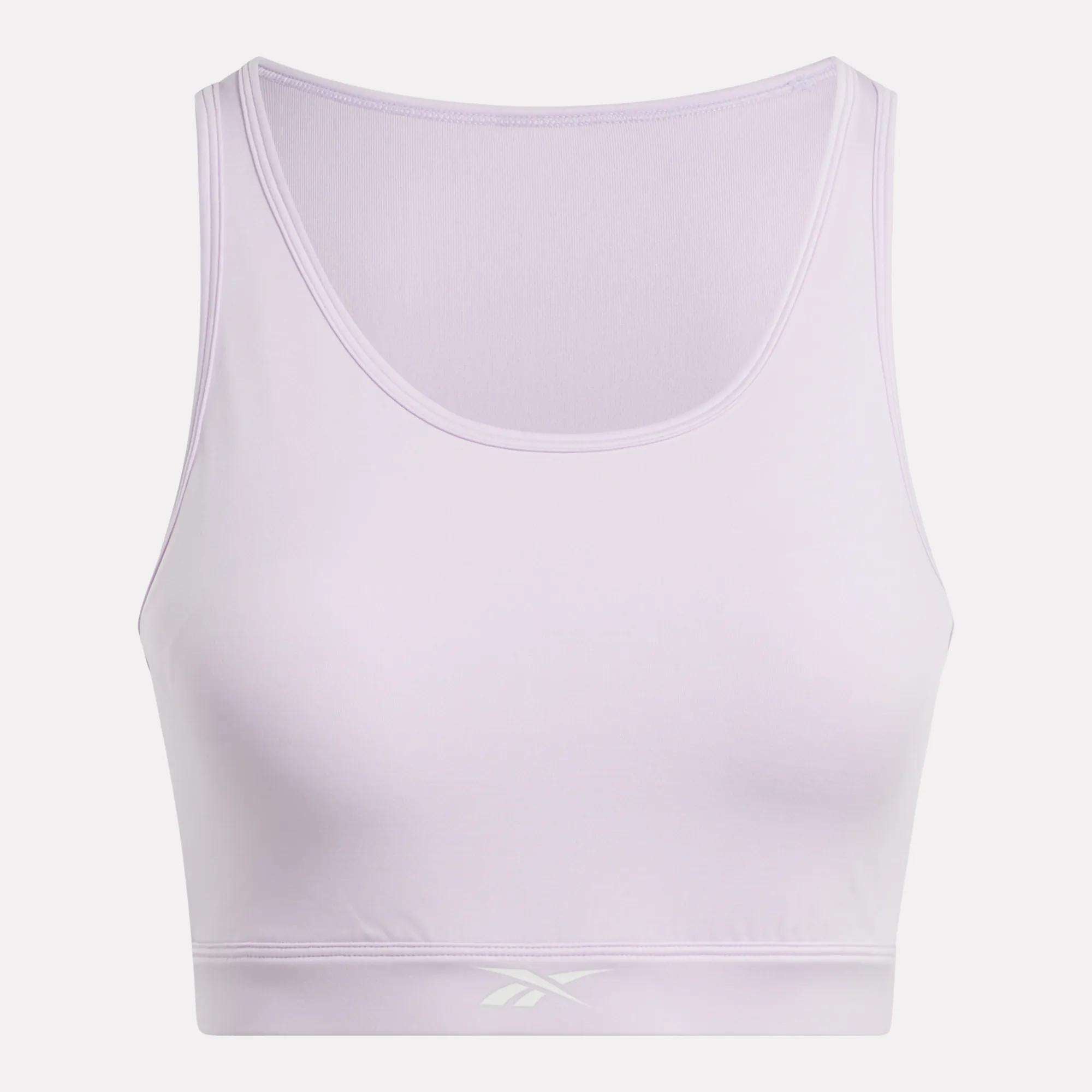 The Women's Core High-Impact Bra by Reebok is a light purple sleeveless crop top with a scoop neckline and subtle front waistband logo. Featuring sweat-wicking fabric, it's ideal for high-impact training. Shown on a white background.