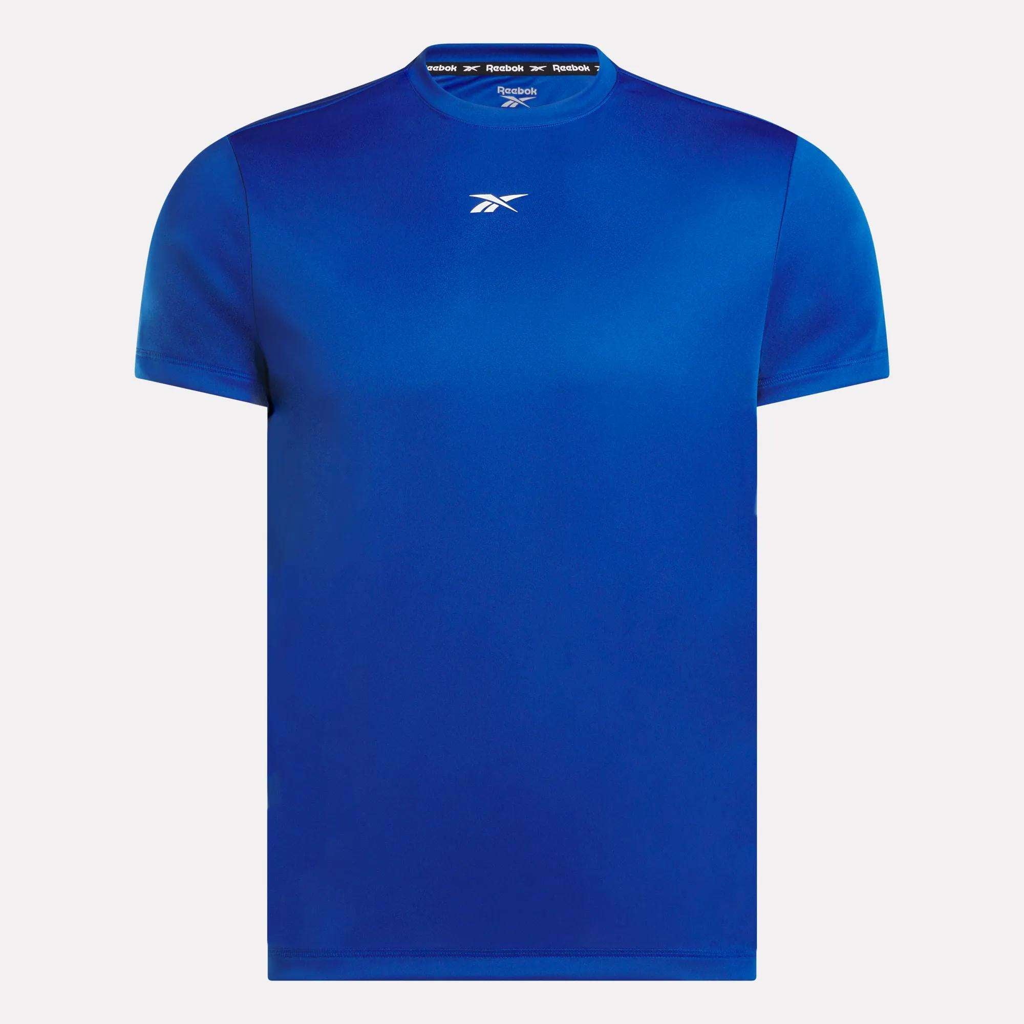 The Reebok Men's ID Train Short Sleeve Tech Tee is a royal blue training shirt with a white logo on the chest, made from RBK-DRY fabric to keep you cool and comfortable. Perfect for workouts, shown on a white background.