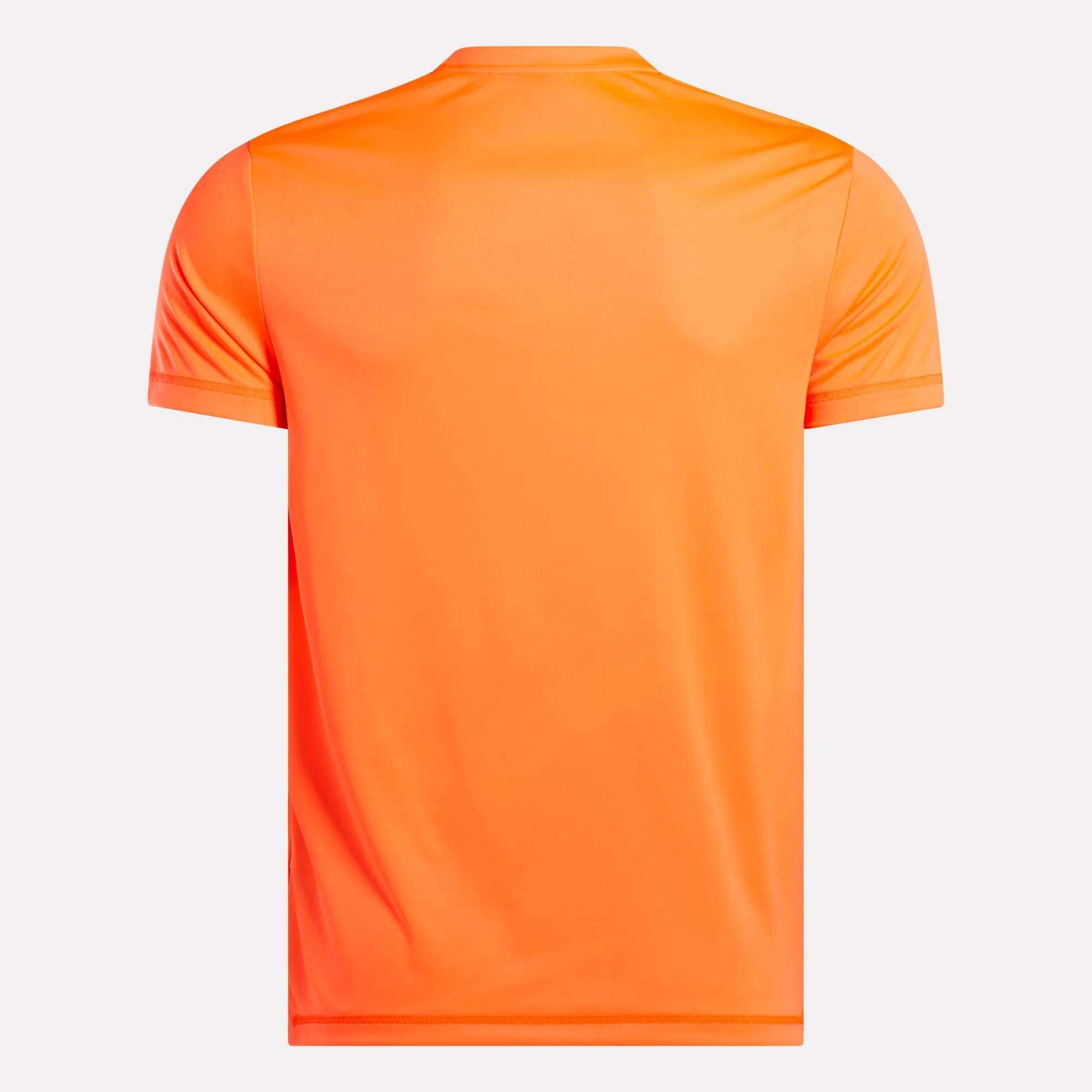 The Reebok Men's ID Train Short Sleeve Tech Tee is shown from the back in orange against a light gray background. This gym shirt is plain with no visible logos or designs, offering a clean and simple look.