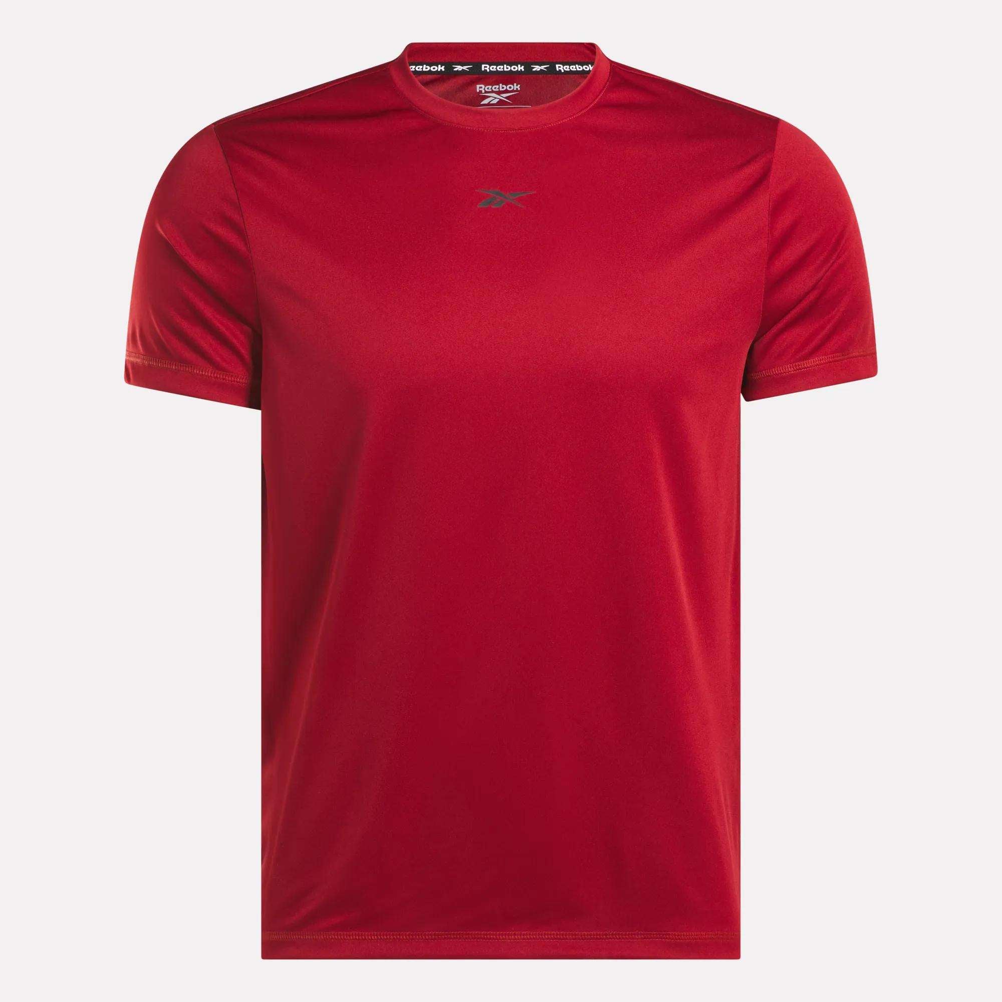 The Reebok Men's ID Train Short Sleeve Tech Tee is a plain red workout shirt featuring a small chest logo and a printed label inside the collar, shown against a white background.