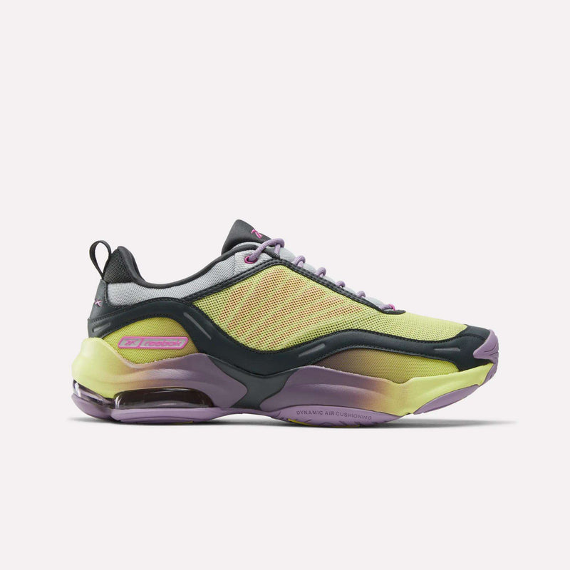 The Reebok DMX Series 3000 Shoes are stylish athletic sneakers featuring a yellow mesh upper, black and purple details, lace-up design, cushioned sole with DMX moving air tech, and bold purple accents for modern comfort.