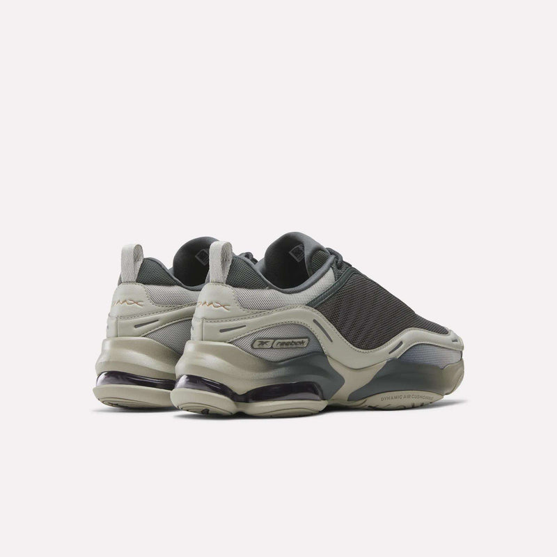 The Reebok DMX Series 3000 Shoes, shown from a rear-side angle on a plain light background, feature gray mesh and synthetic uppers with chunky soles and DMX moving air technology for enhanced comfort.