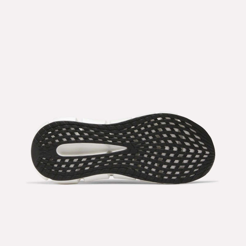 The image shows the black and white sole of Reebok Men's FloatZig 2 Running Shoes, viewed from below. The grid-like tread and open midfoot cutout highlight its energy-returning cushioning. The background is plain white.