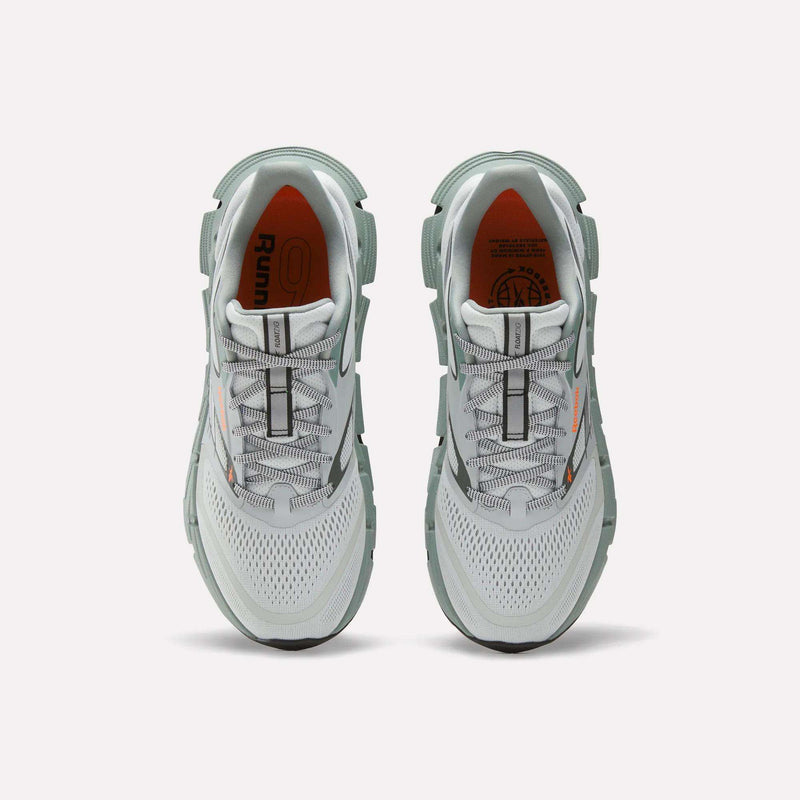 A pair of Reebok Men's FloatZig 2 Running Shoes in gray and white, featuring supportive uppers, mesh design, orange interior accents, and detailed laces, viewed from above on a plain white background.