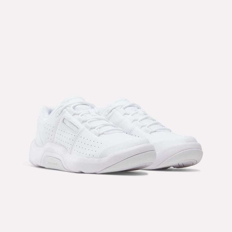 Reebok DMX Comfort+ Classic Shoes, a pair of white low-top athletic sneakers featuring dynamic air cushioning.