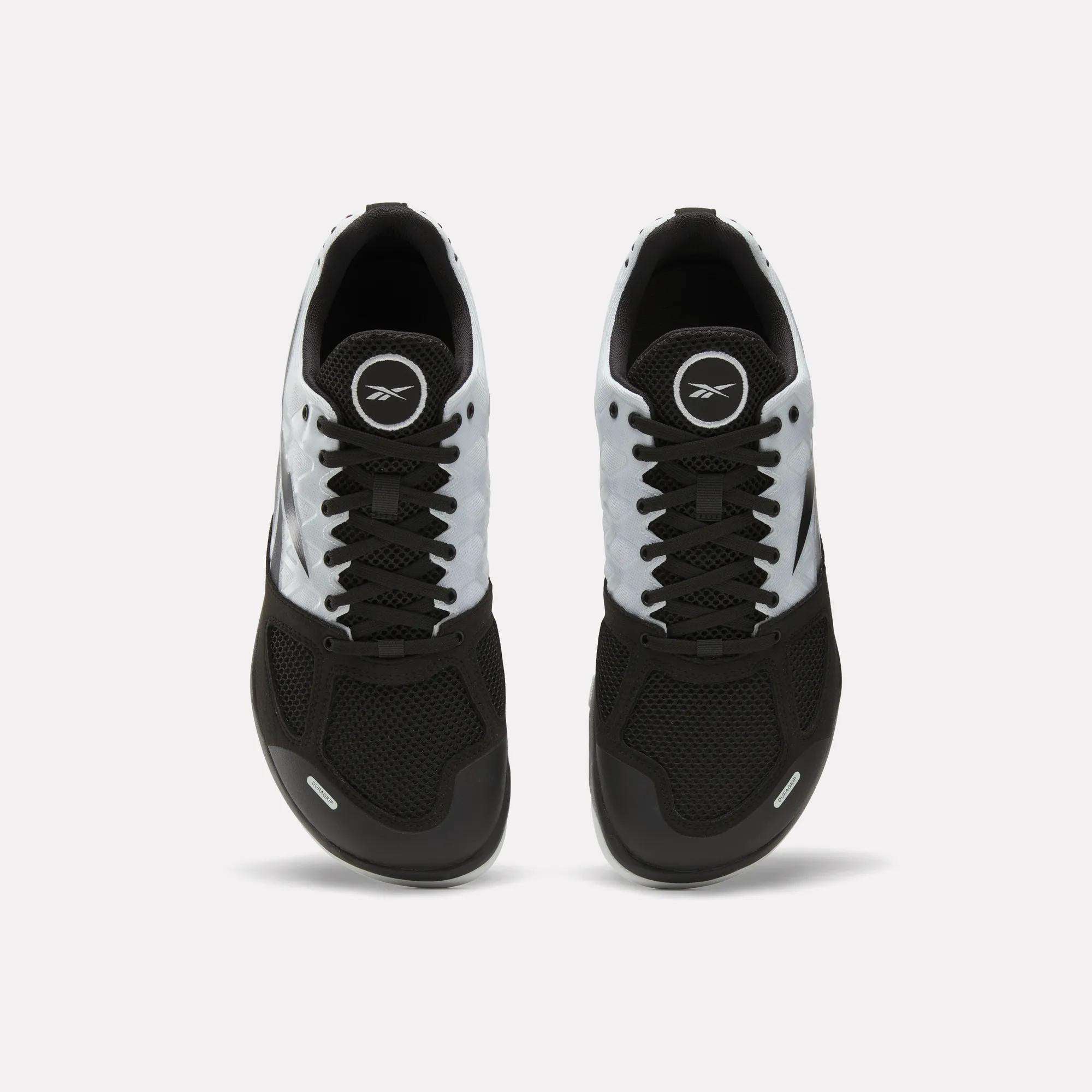 A pair of Men's Nano 2.0 Training Shoes by Reebok in black and white, featuring mesh uppers, laces, and the Reebok logo on the tongue, viewed from above on a plain white background—ideal for functional fitness.