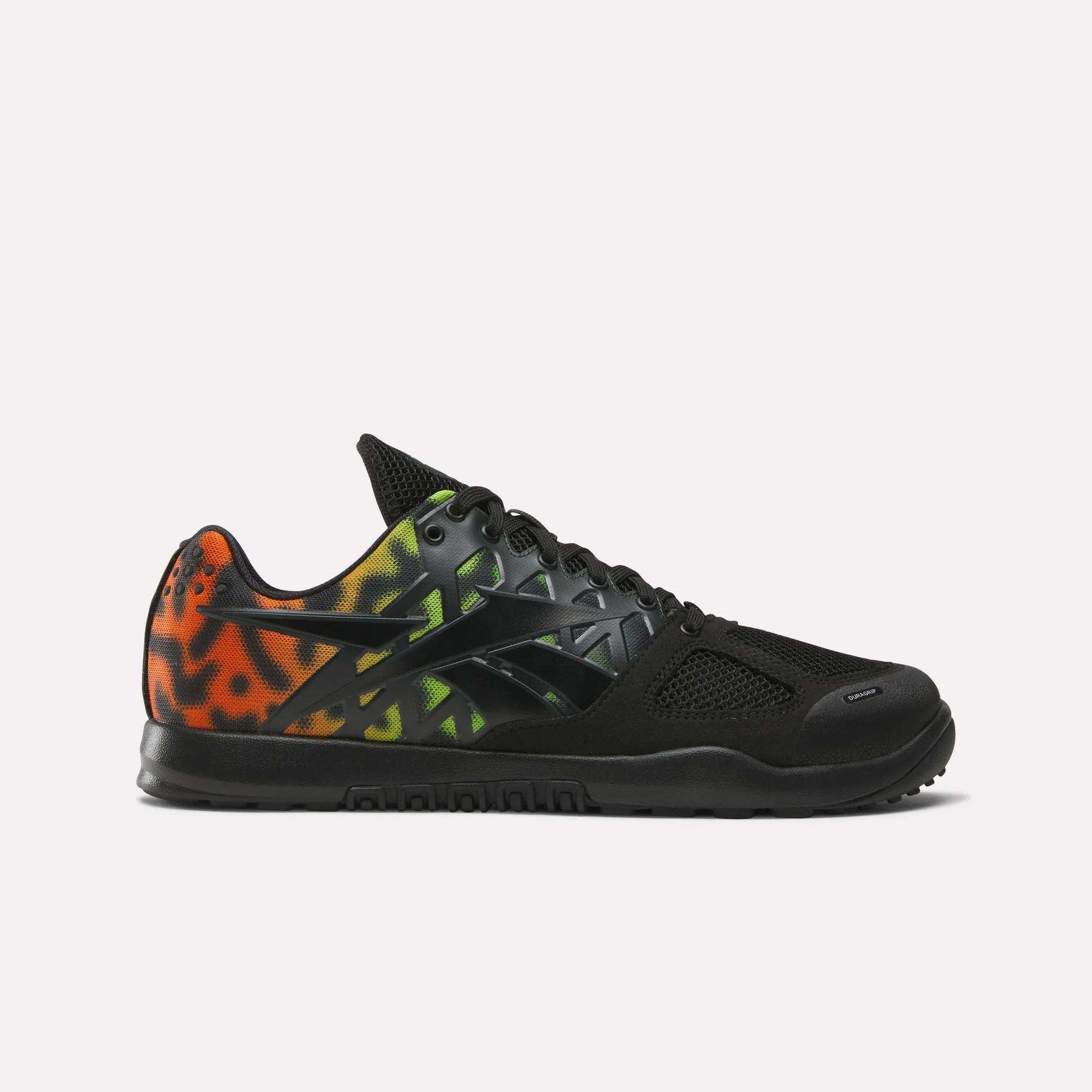 The Reebok Men's Nano 2.0 Training Shoes feature a black mesh upper, gradient leopard print in orange, yellow, and green on the heel and side, black laces, and a black sole—ideal for functional fitness routines.