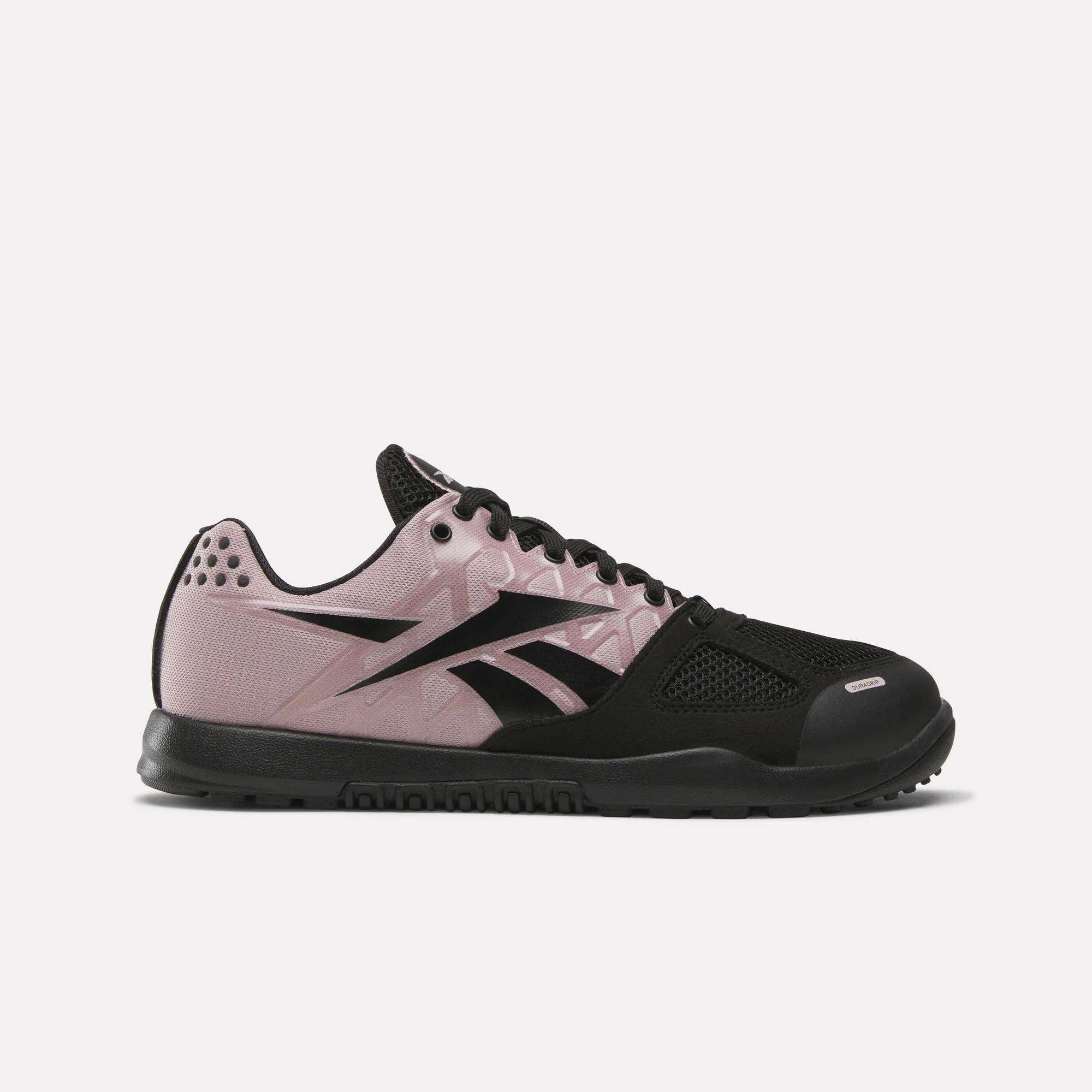 The Reebok Women's Nano 2.0 Training Shoes in pink and black feature black laces, a durable black sole, and a bold side logo—perfect for functional fitness and shown on a plain white background.