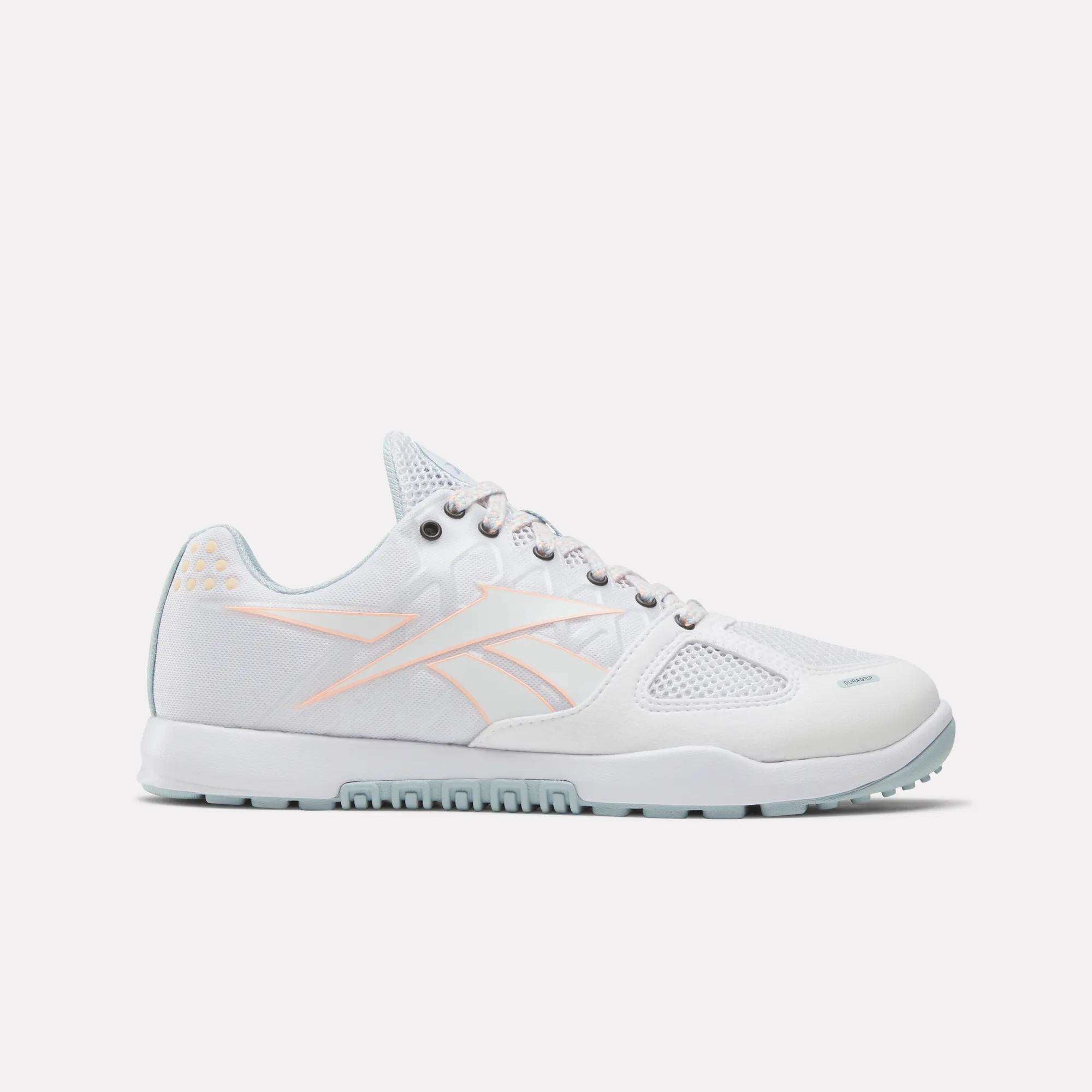 The Women's Nano 2.0 Training Shoes by Reebok feature a white design with pink accents, inspired by the original Nano 2.0 and ideal for functional fitness workouts.