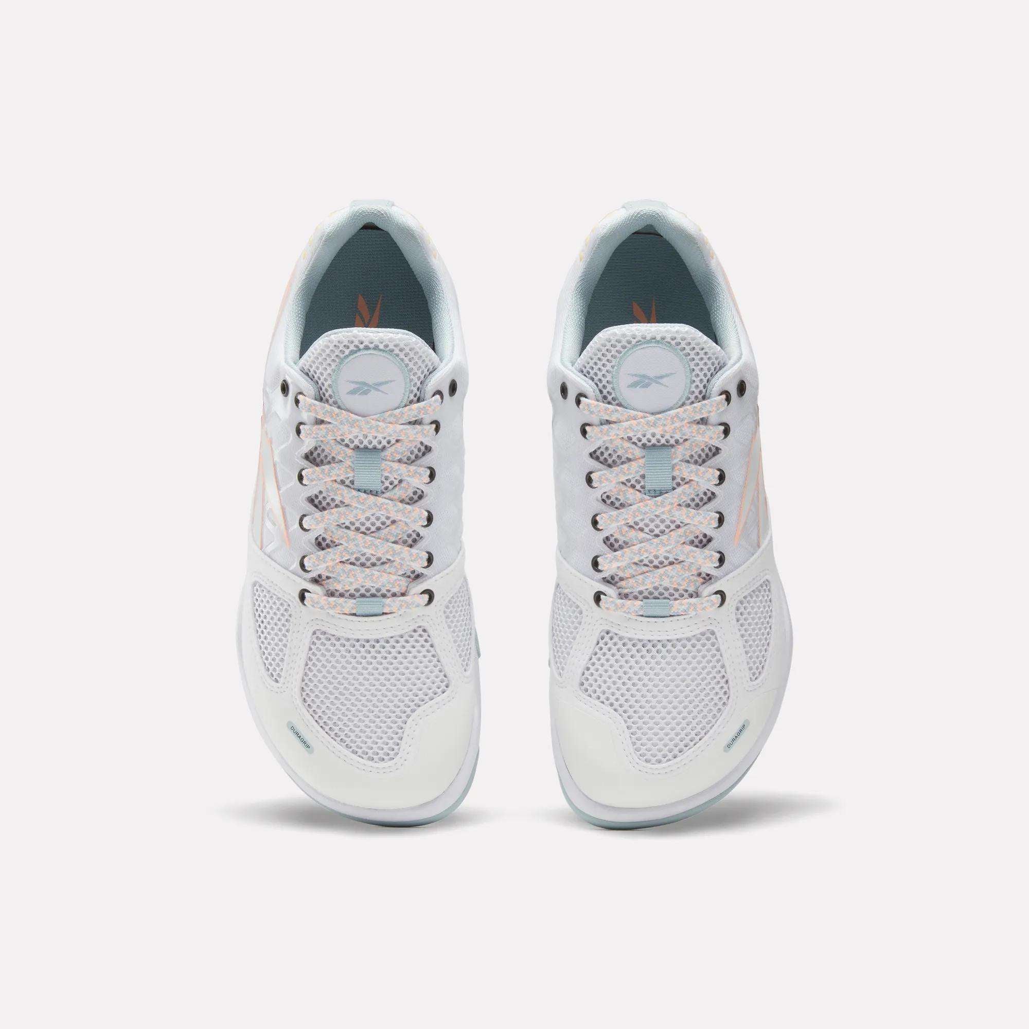 Reebok Women's Nano 2.0 Training Shoes feature white mesh uppers, light blue interiors, and light laces—designed for functional fitness and shown top-down on a plain white background.