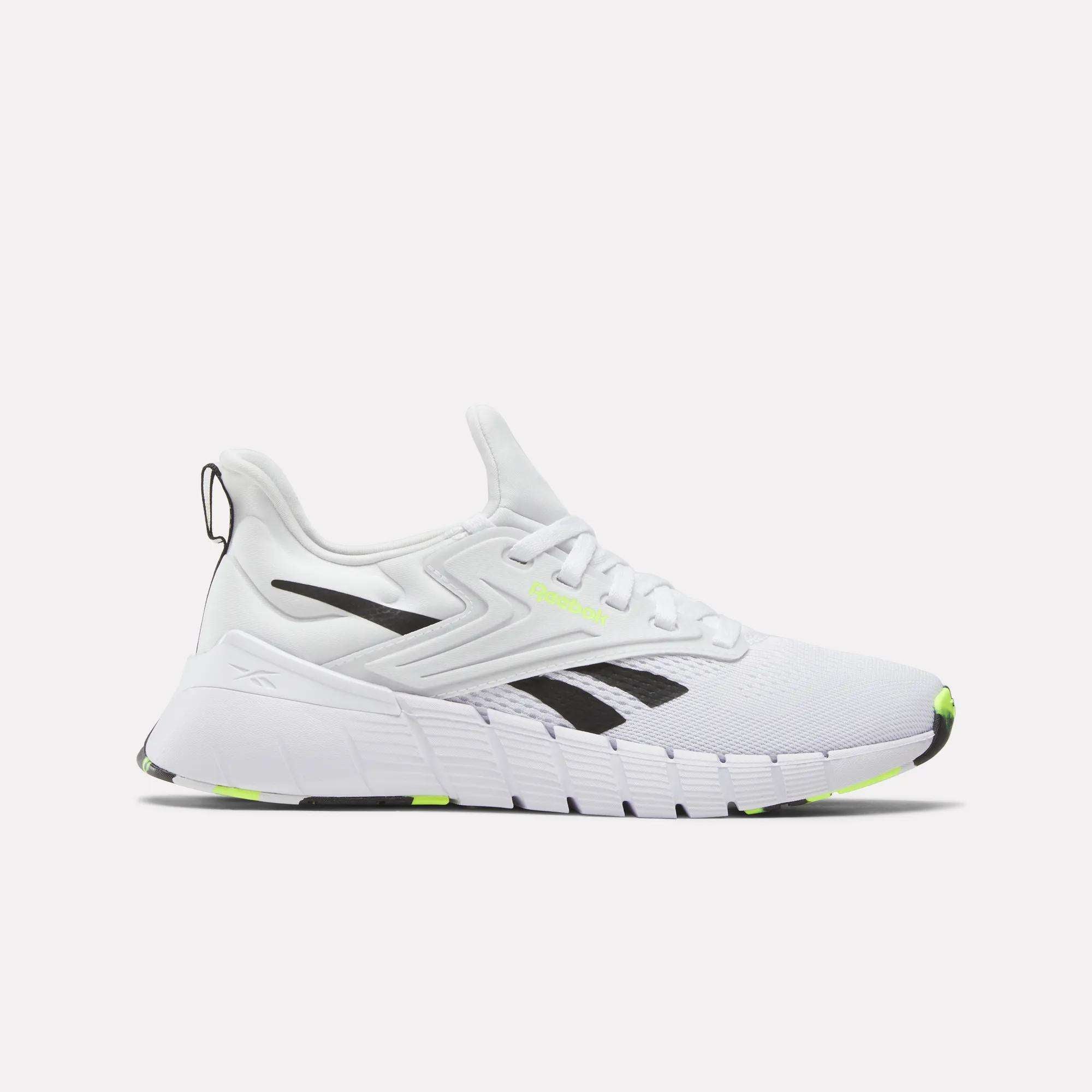 The Reebok Women's Nano Gym Training Shoes feature a chunky sole, black and neon yellow accents, a mesh upper, lace-up closure, and bold black logo—perfect cross-training shoes for weight training. Shown against a white background.