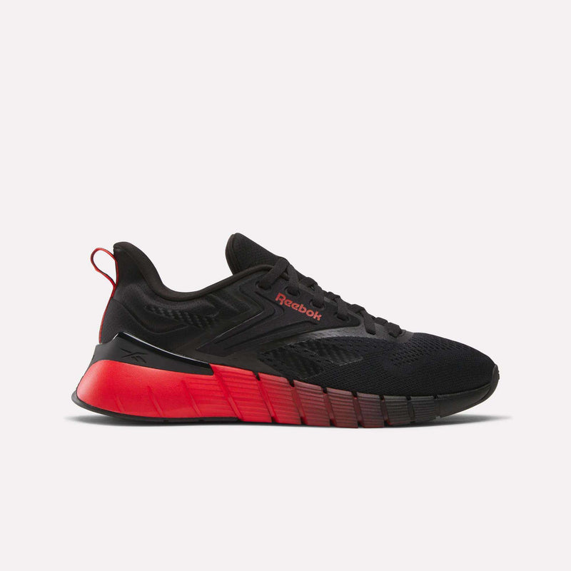 The Reebok Men's Nano Gym Training Shoes in black with red accents and a red gradient midsole are shown in profile on a white background—an ideal choice for men's cross-training.