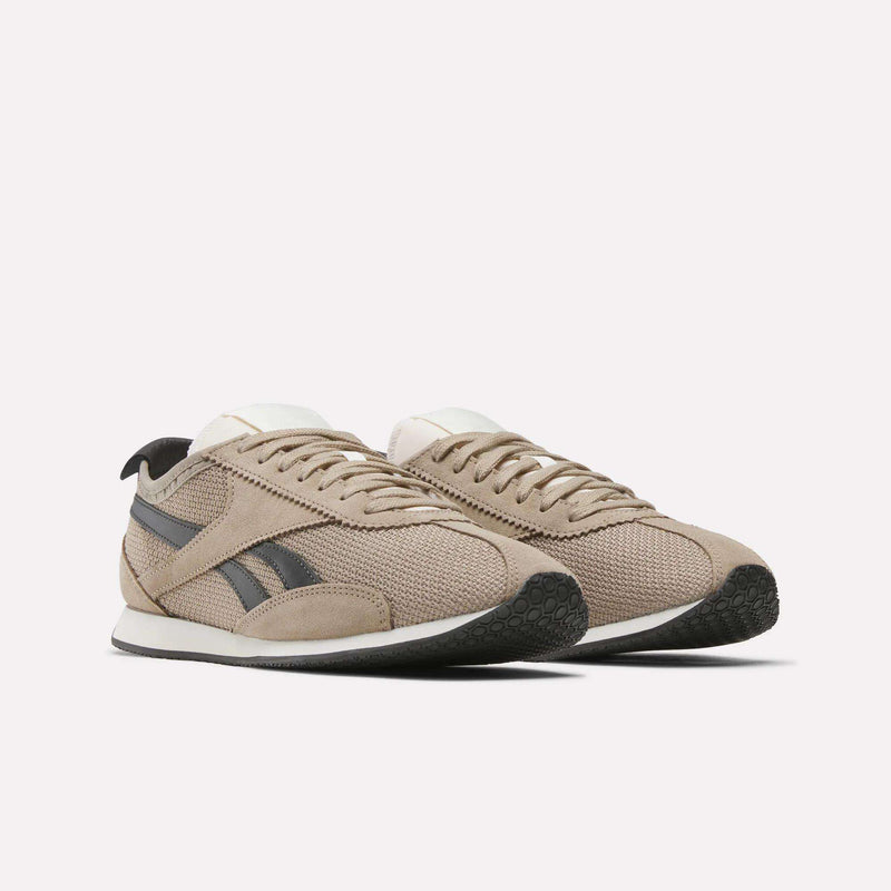 The Reebok R400 Shoes feature a beige and black colorway with white soles, mesh and suede textures, plus black logo stripes—ideal for vintage sneaker enthusiasts.