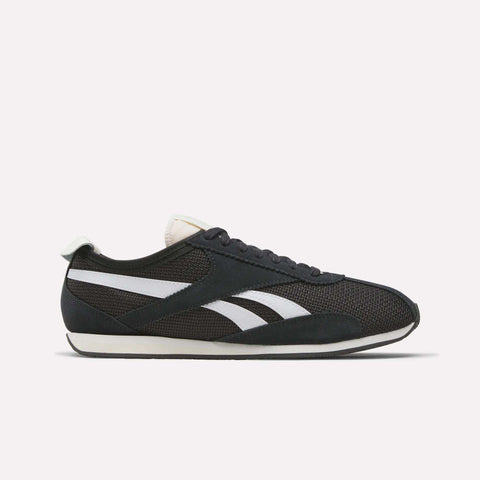 The Reebok R400 Shoes are black athletic sneakers with white stripes, a white sole, and black laces shown side view on a plain white background—classic vintage style inspired by retro running shoes.