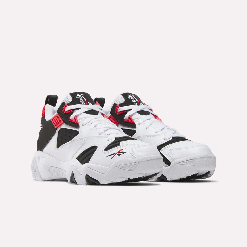 A pair of Reebok Brutus Low Shoes in white, black, and red sit side by side on a plain white background. With chunky soles and bold branding on the tongue and side, these heritage sneakers deliver classic street-ready style.