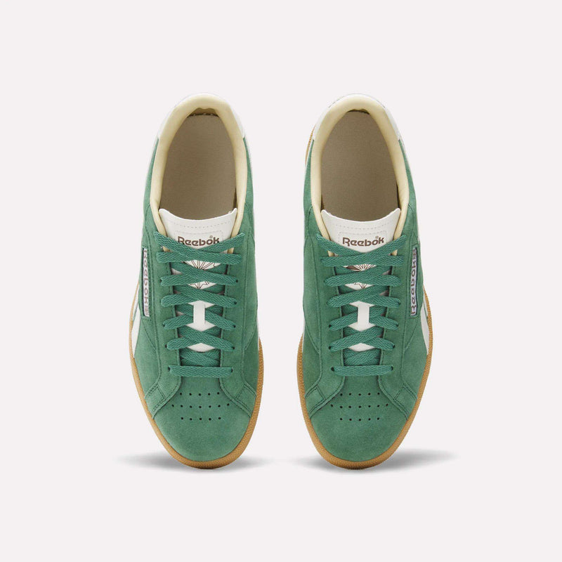 The Reebok Club C Grounds UK Shoes feature premium green suede, white laces, and gum soles, shown from above against a plain white background.
