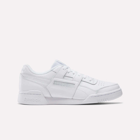 The Reebok Workout Plus Shoes are shown from the side against a plain white background, featuring a low-top design, lace-up closure, and subtle branding that recalls classic '80s fitness style.