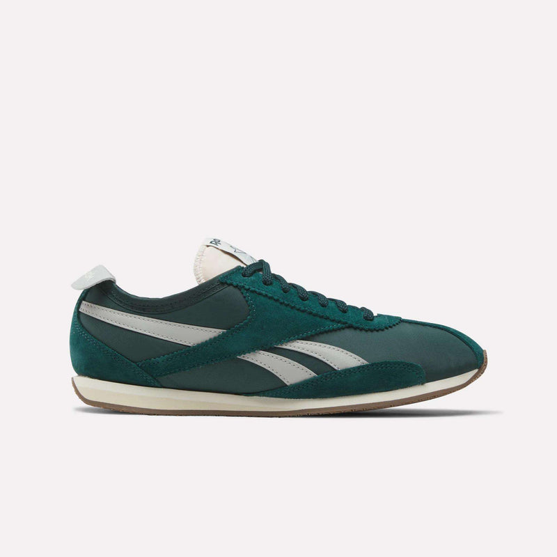 The Reebok R400 Shoes, featuring green and white suede and leather with signature side stripes, plus a white and beige sole, are retro track sneakers displayed against a plain light background.